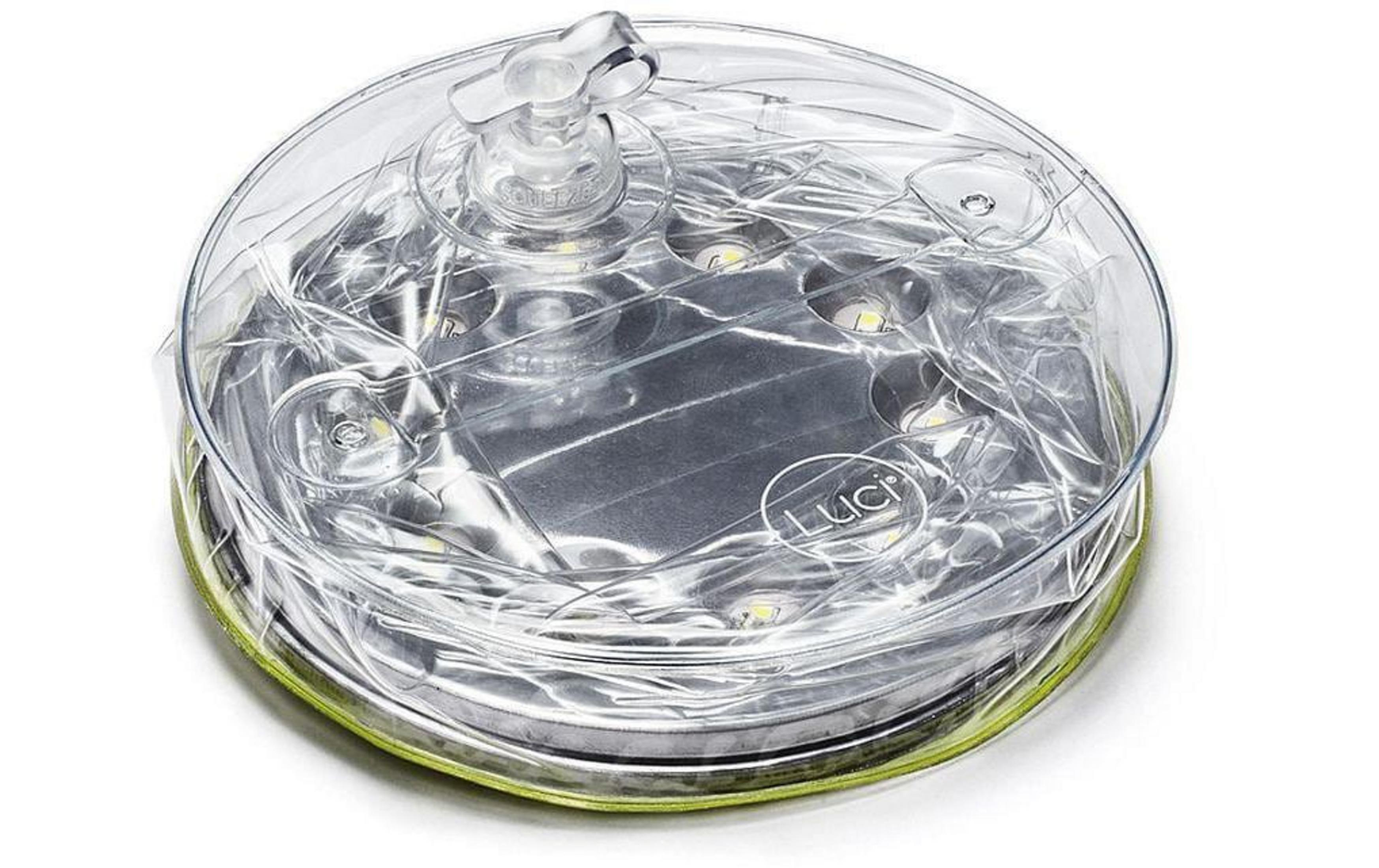 Eine durchsichtige, runde aufblasbare Laterne mit internen LEDs und einem Ventilteller.