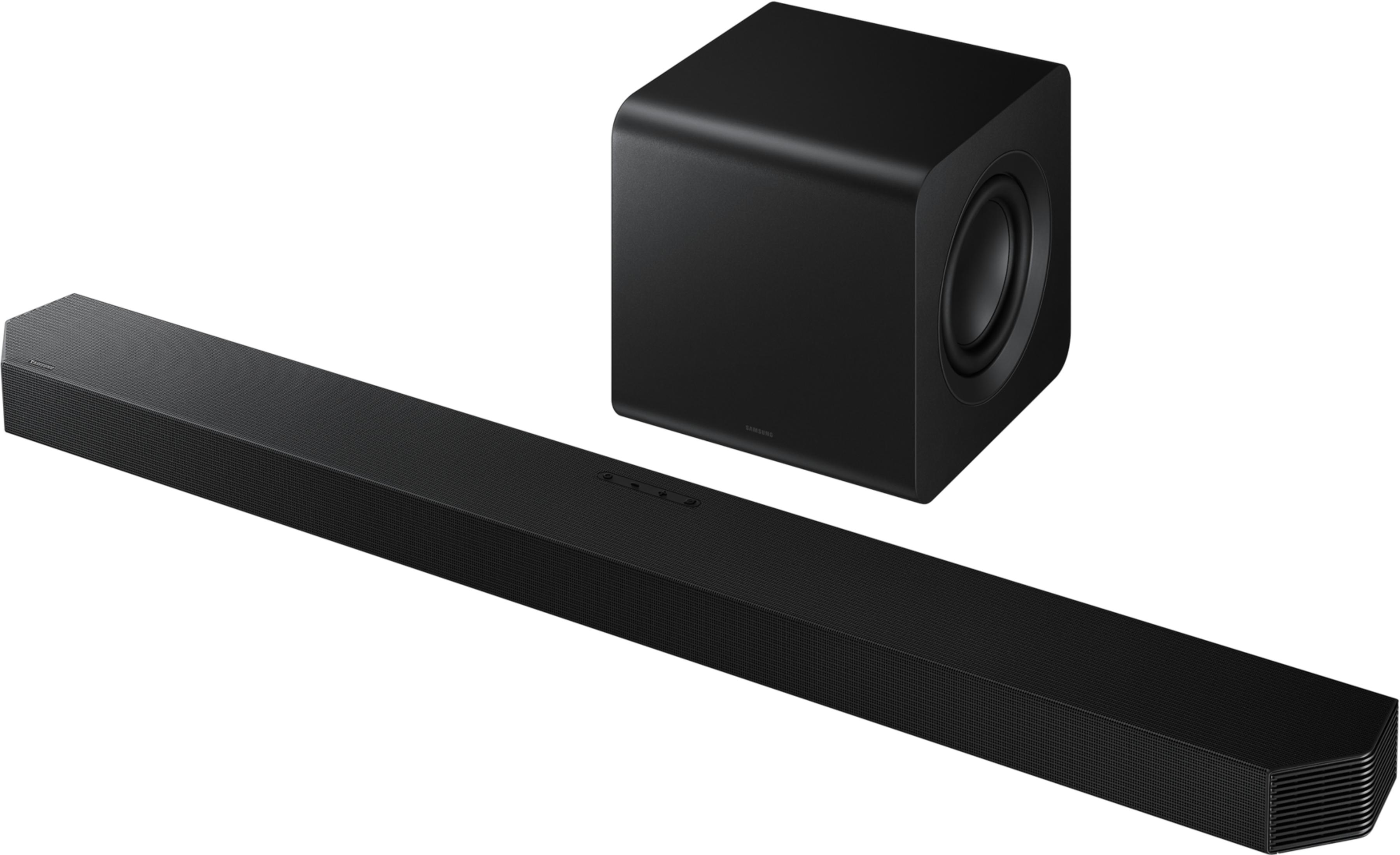 Soundbar e subwoofer neri su sfondo bianco.
