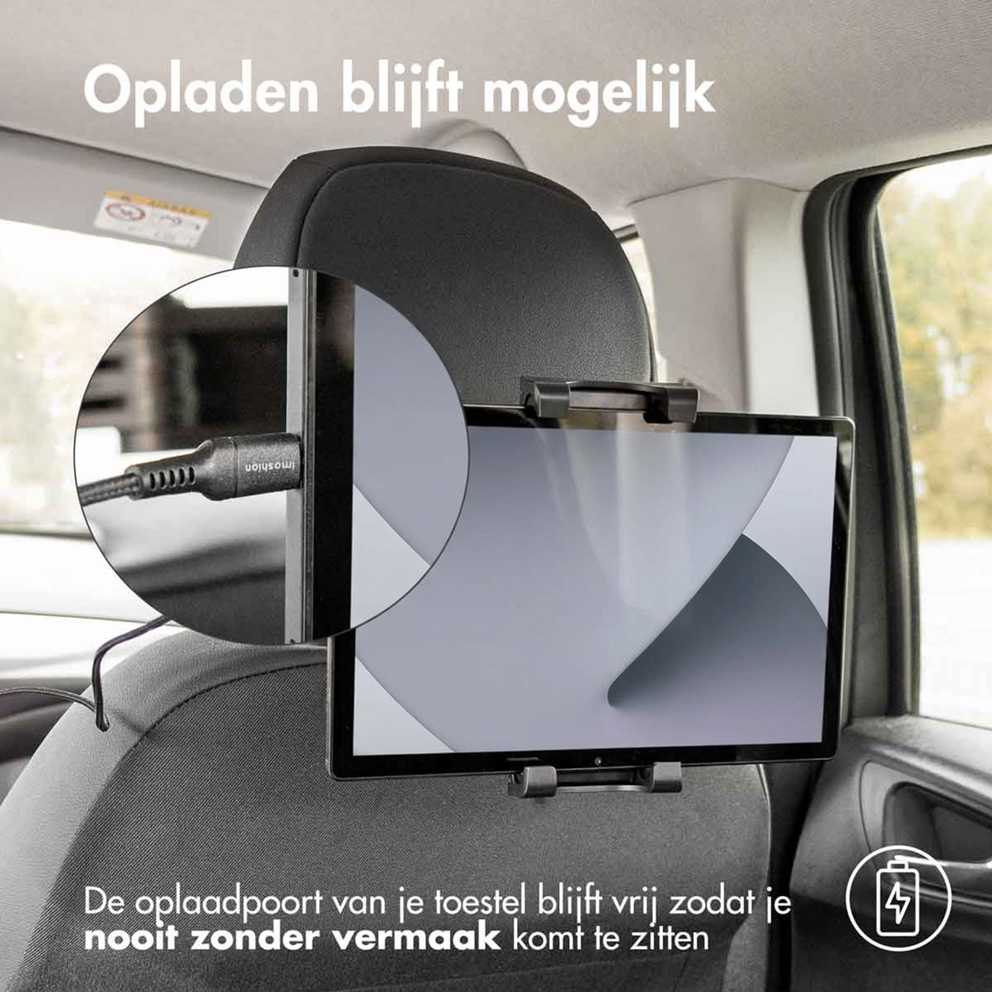 Een tablet is gemonteerd op een autostoel en wordt opgeladen.