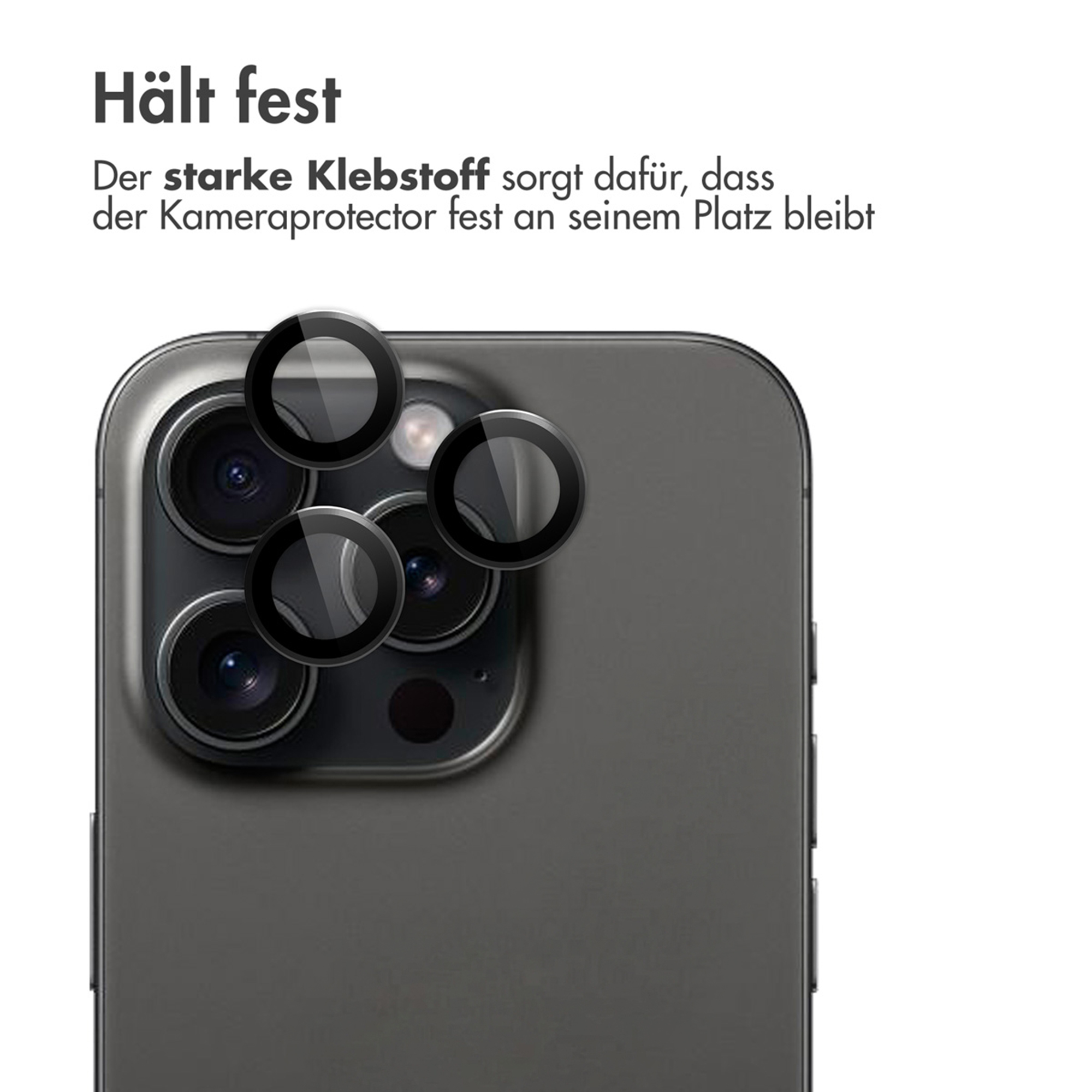 Quatre protections d'objectif d'appareil photo en verre reposent sur un smartphone sombre.