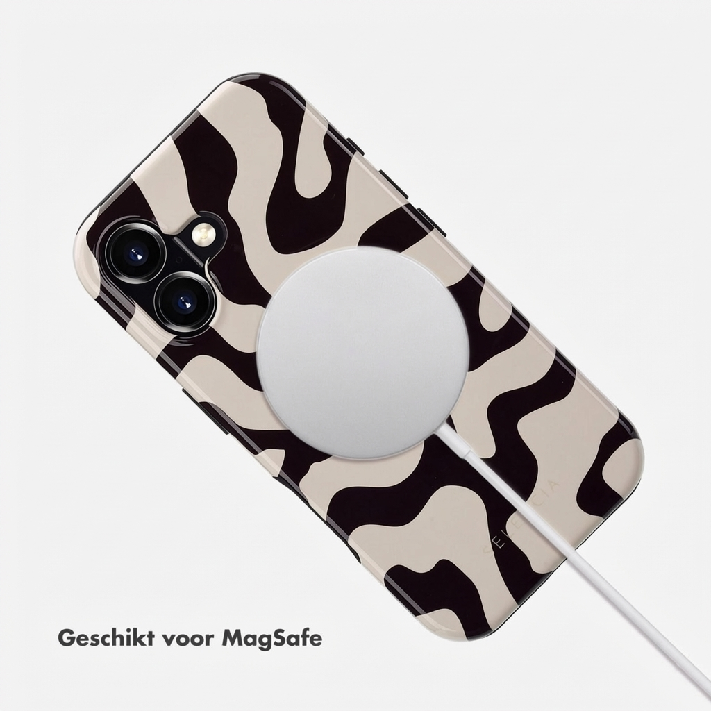 Un téléphone à motif noir et blanc avec chargeur MagSafe.