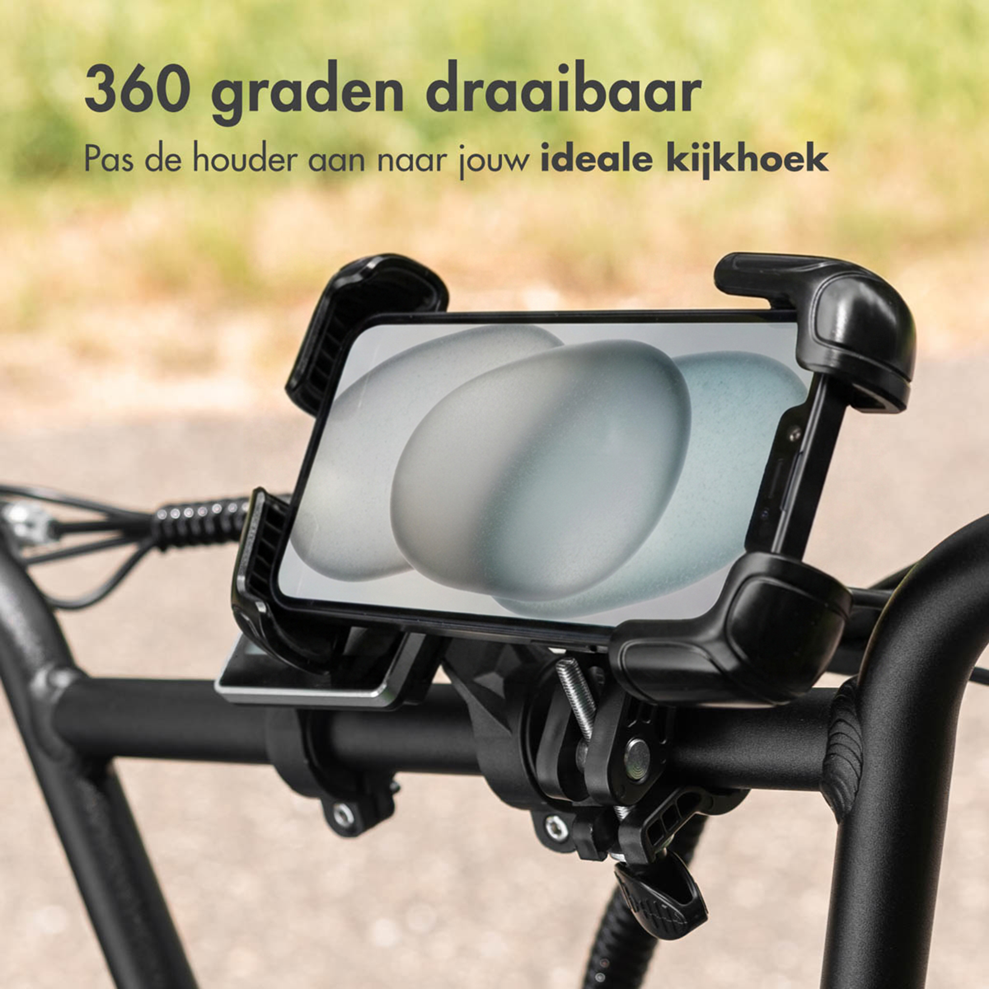 Black bicycle phone mount attached to handlebars. Displays an image of eggs.