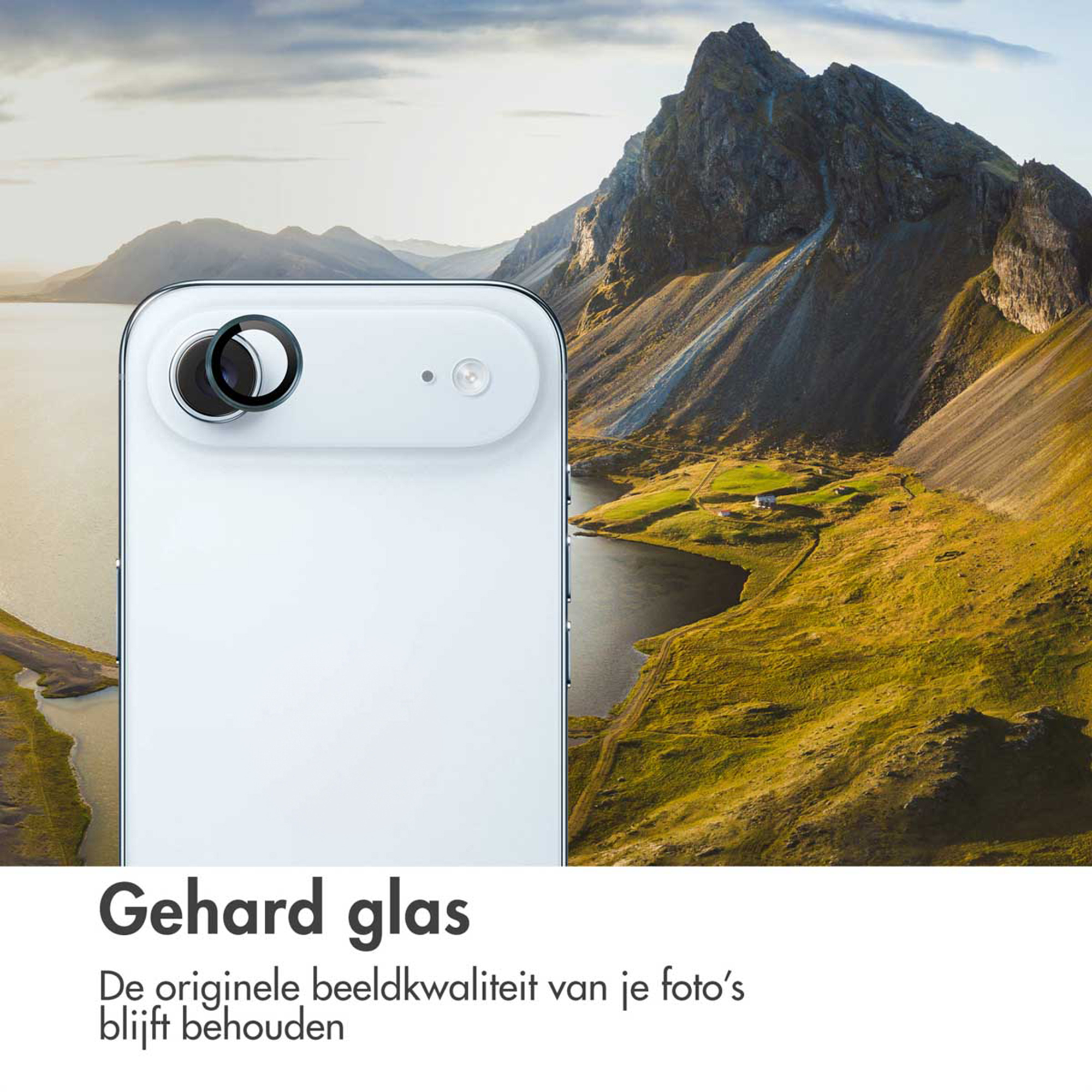 Een witte smartphone met cameralens tegen een berglandschap met meer.