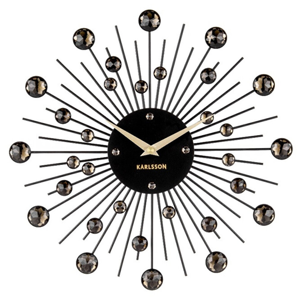Eine schwarze Wanduhr mit silbernen Zeigern und funkelnden Kristallen.