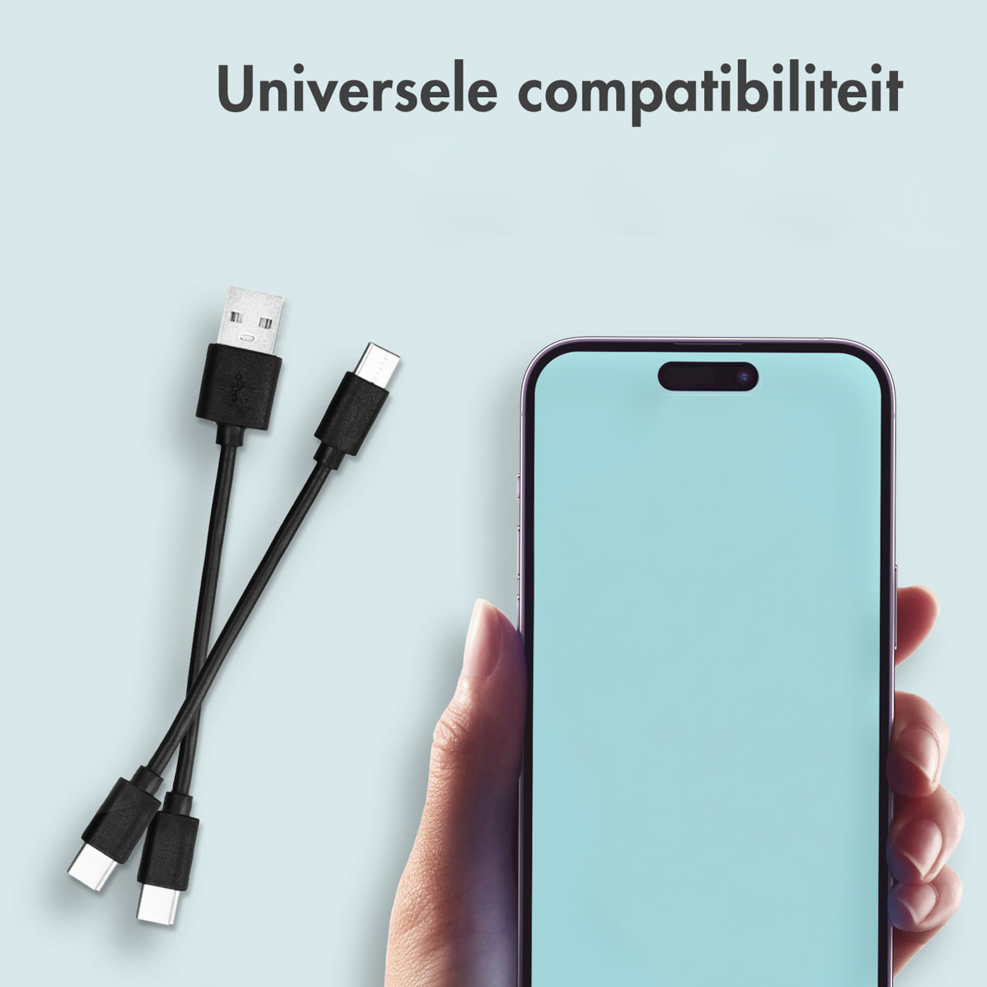 A USB-A and two USB-C cables lie next to a smartphone.