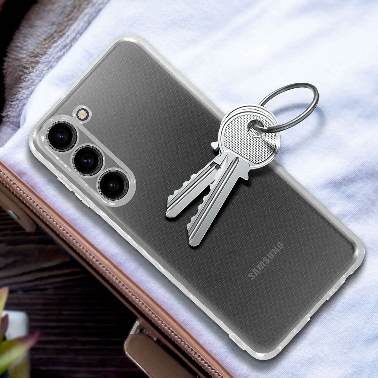Transparente Handyhülle mit silbernen Schlüsseln und Samsung-Logo.