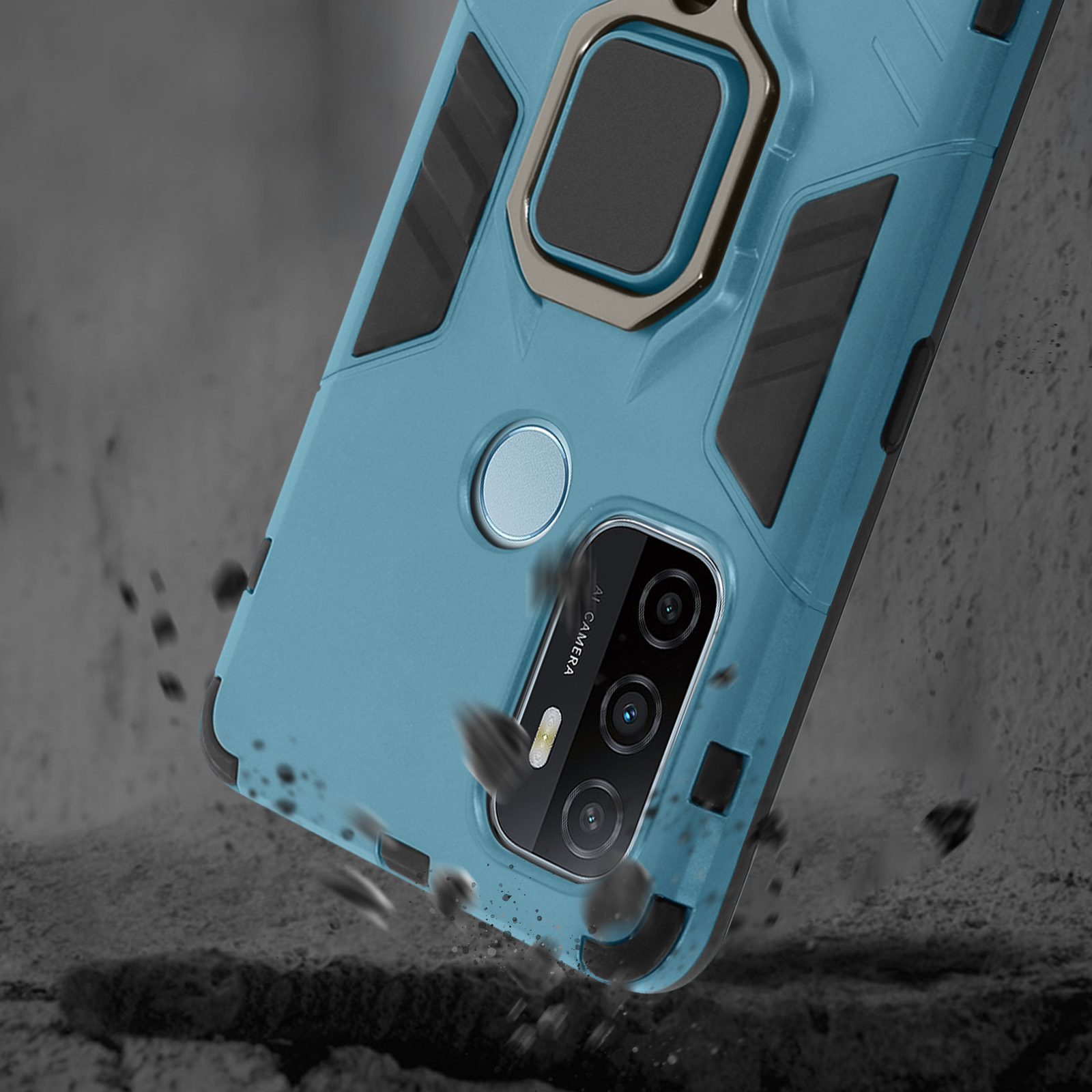 Una custodia per telefono verde acqua con anello cade su terra grigia.