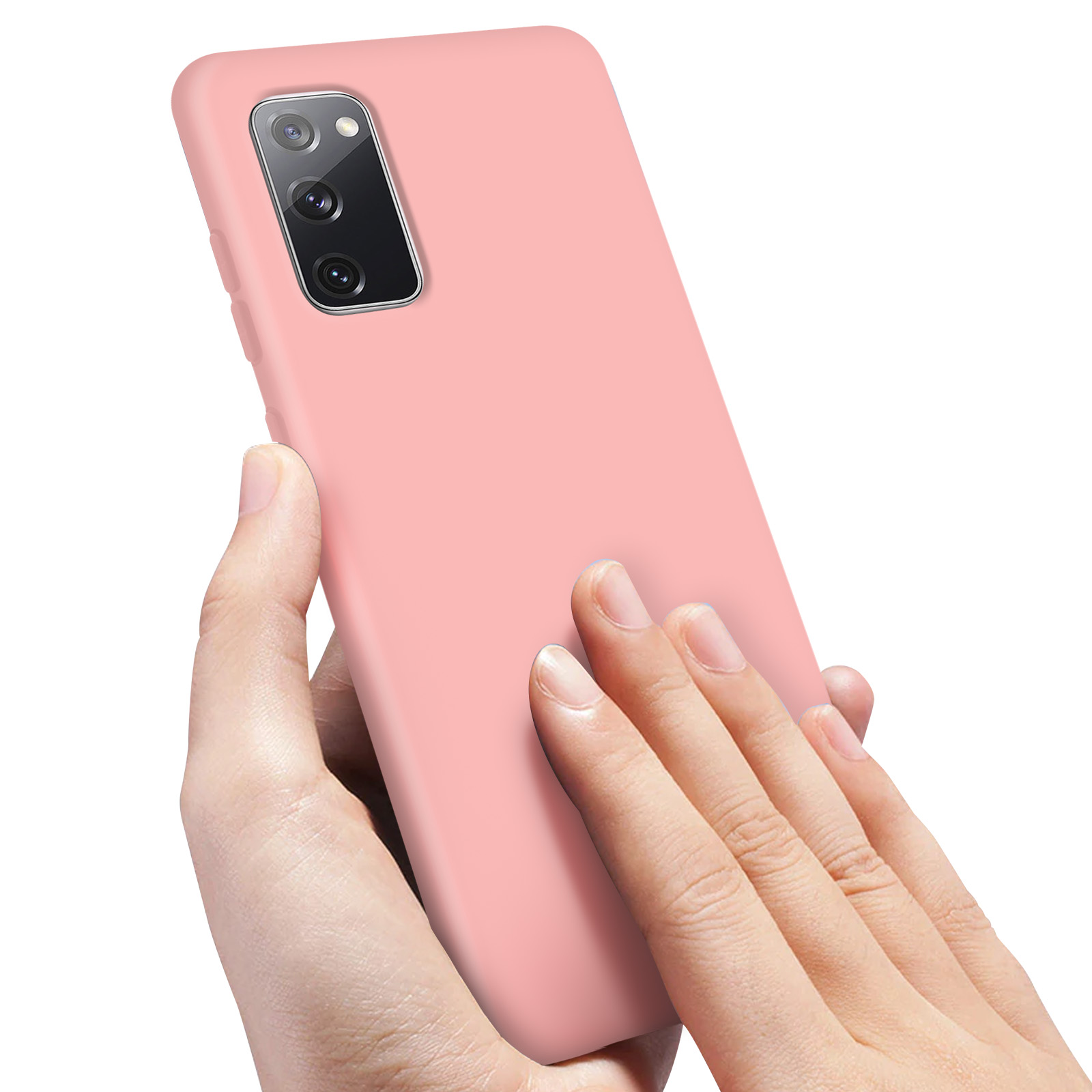 Mains tenant un smartphone rose avec un appareil photo à l'arrière.