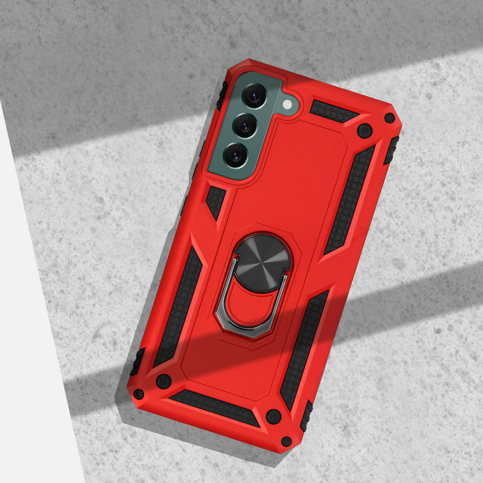 Rode telefoonhoes met ringhouder en cameralensbescherming op beton.