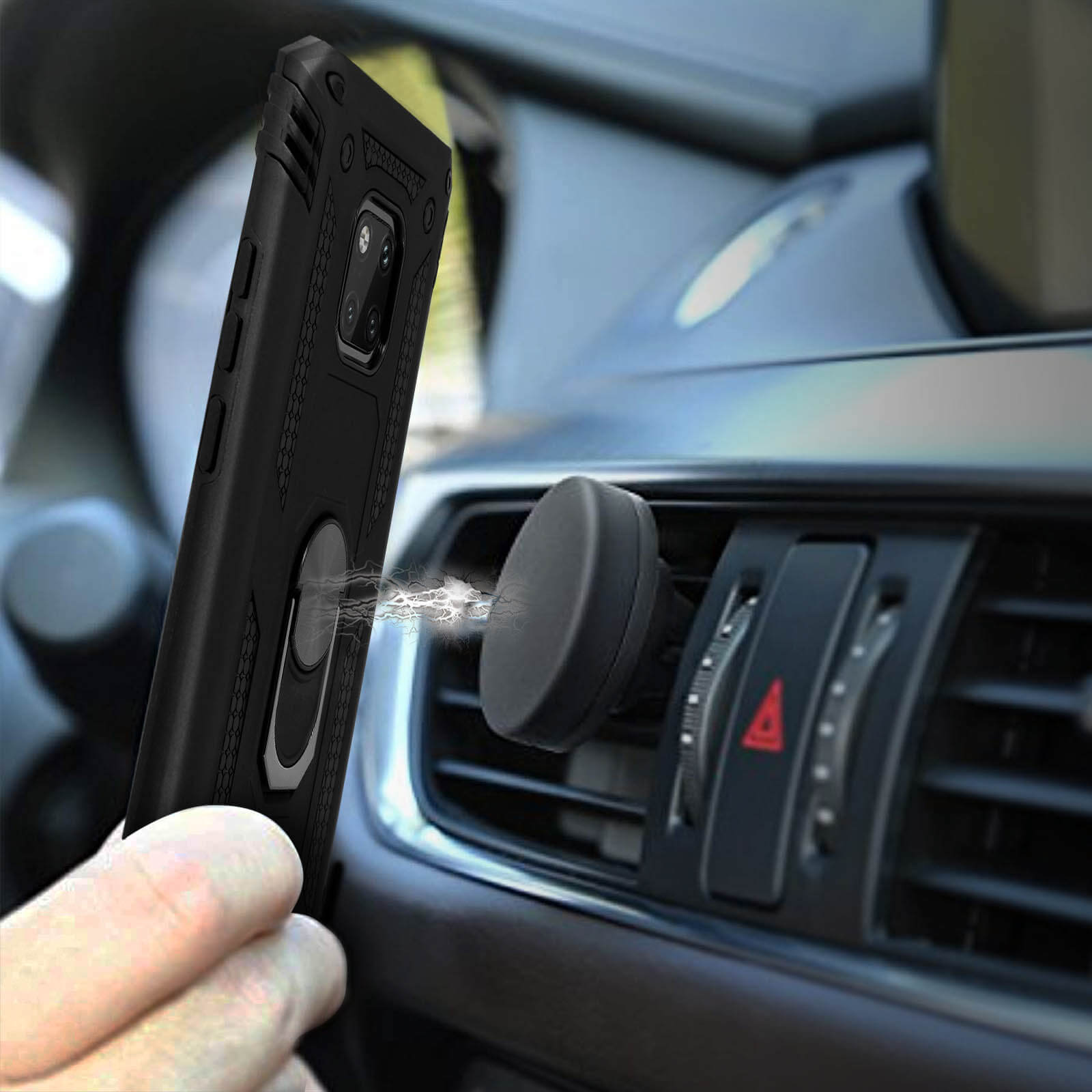 Hand houdt zwarte telefoon met ringhouder bij magnetische auto-houder op ventilatieopening.