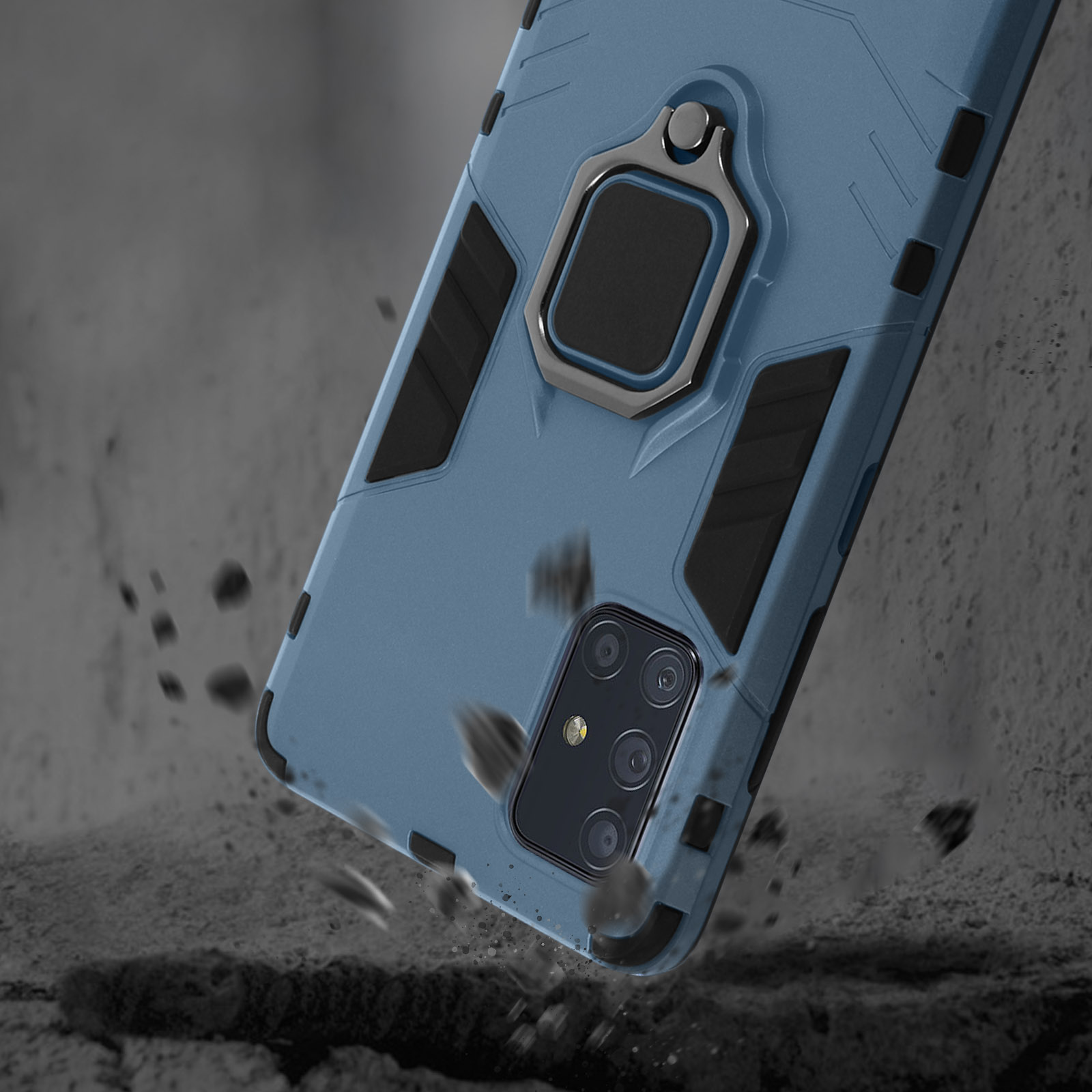 Coque de téléphone bleue avec support anneau tombant sur des rochers gris.