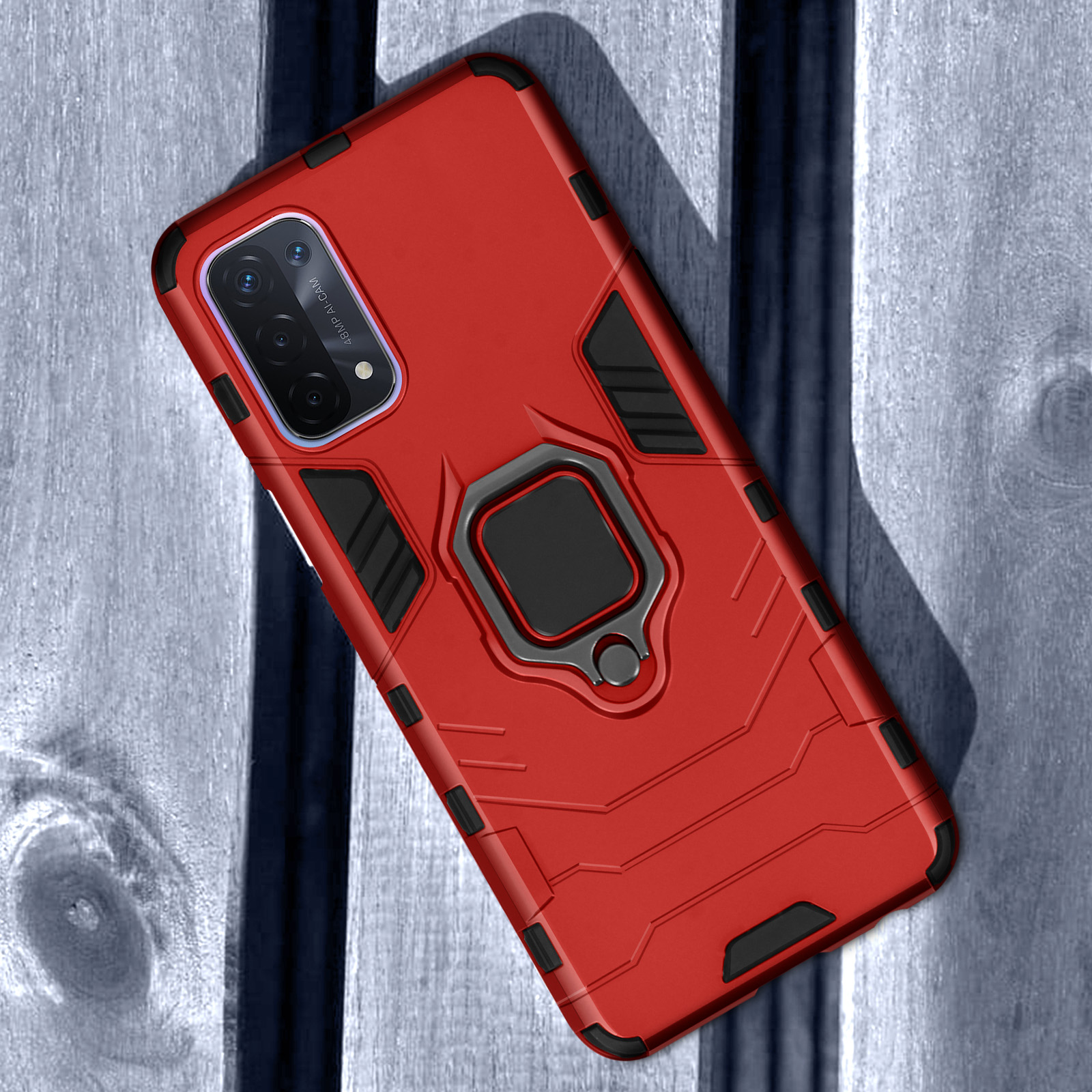 Coque de téléphone rouge avec support anneau sur fond de bois.