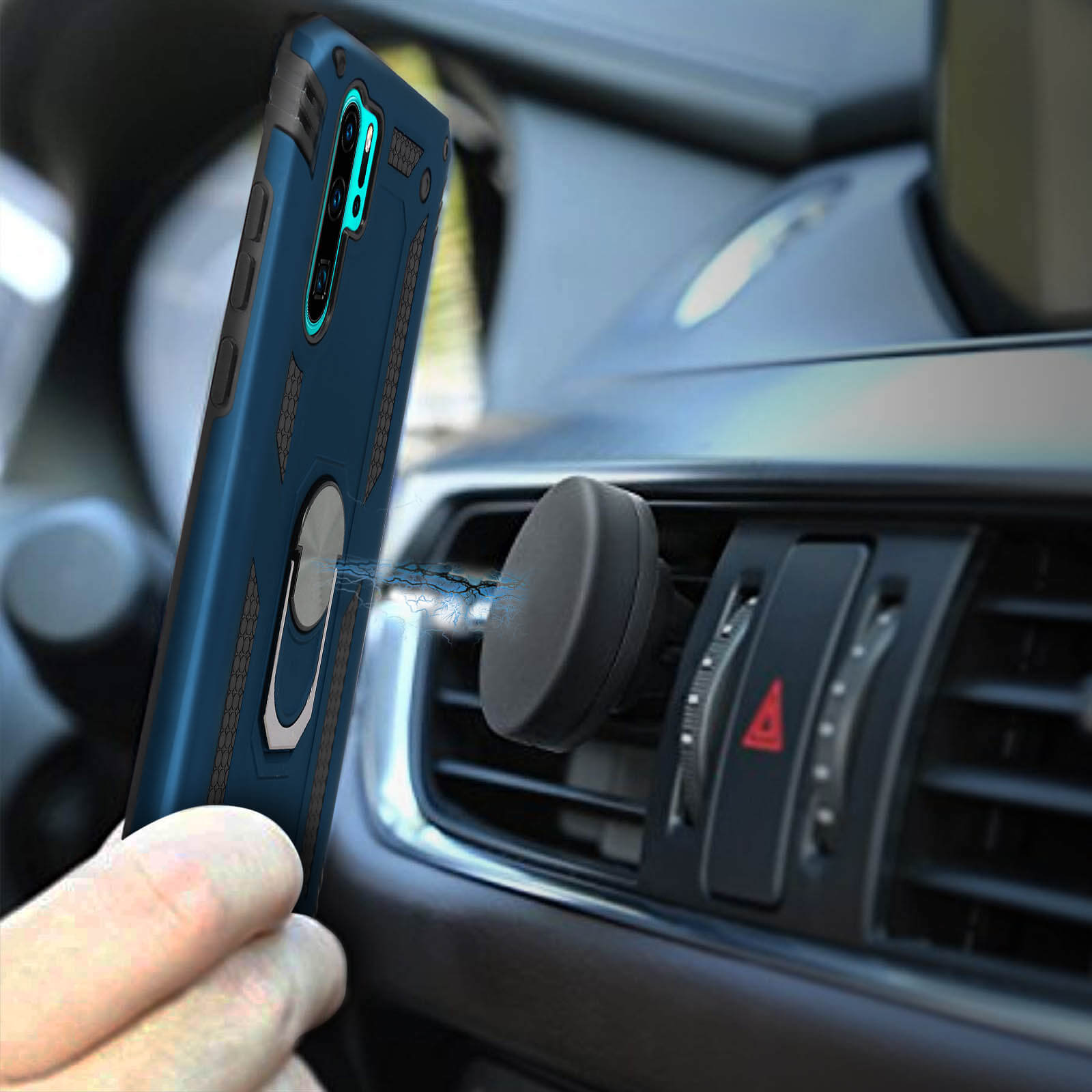 Cover blu per telefono con anello portaoggetti attaccata alla bocchetta auto.