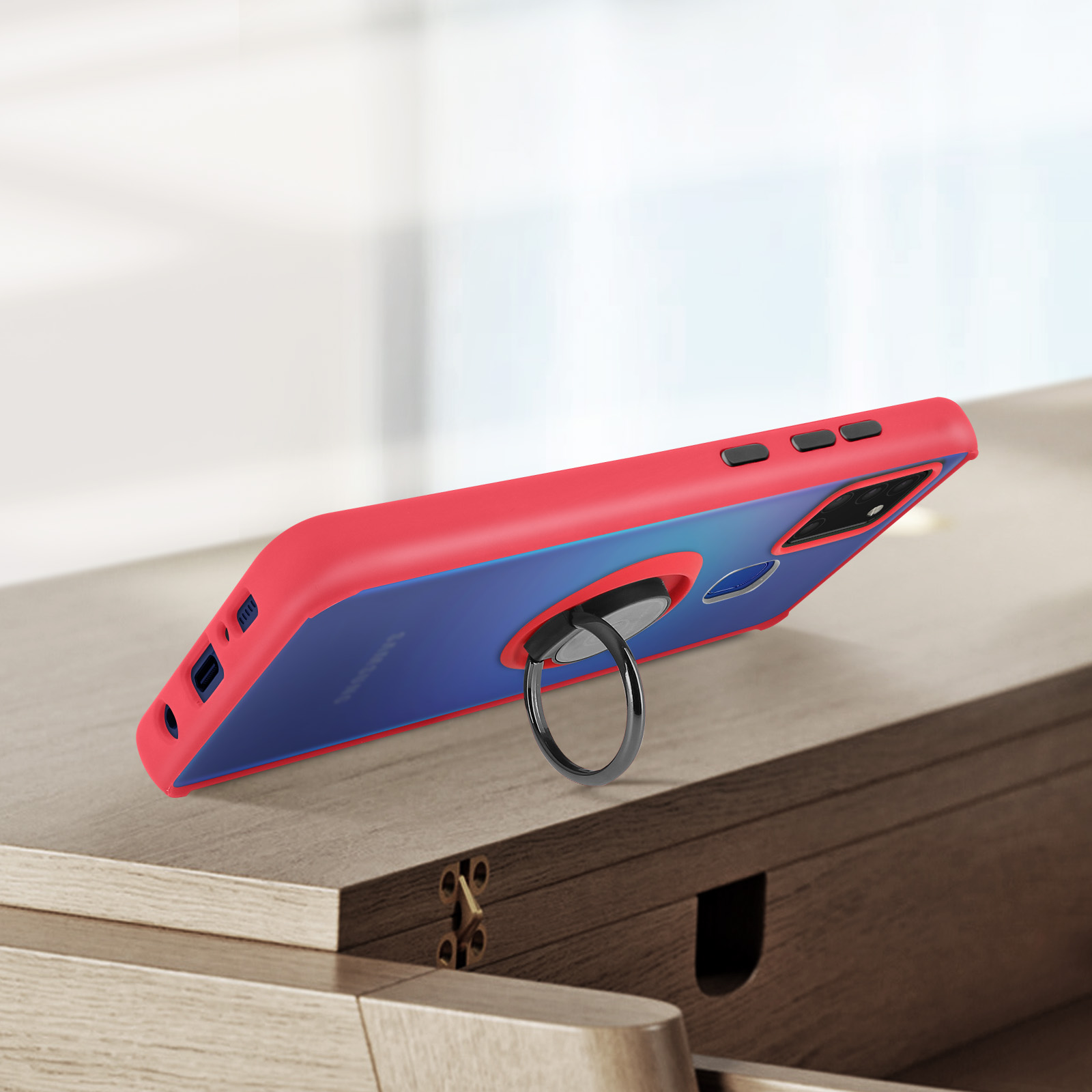 Une coque de téléphone rouge et bleue avec un support anneau.