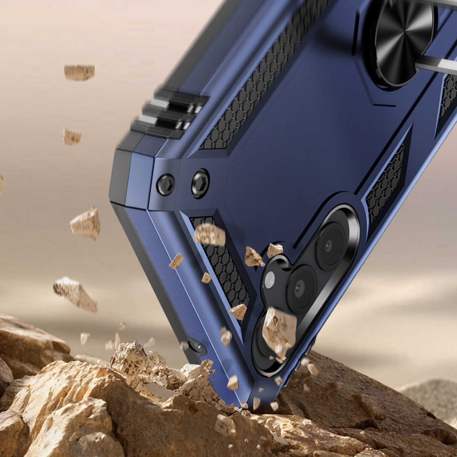 Custodia blu per telefono cade su rocce, polvere in volo.