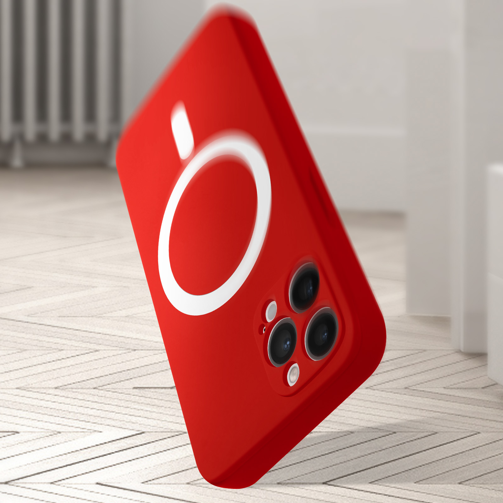 Coque de téléphone rouge avec cercle blanc et objectifs photo sur plancher bois.