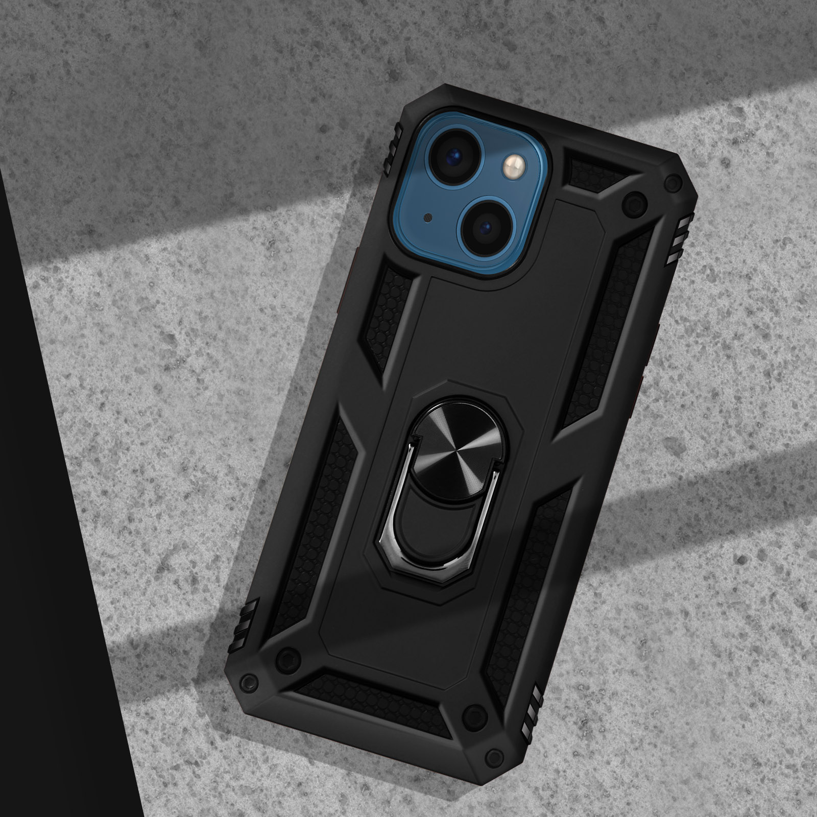 Custodia nera per telefono con anello porta anello su superficie di cemento.