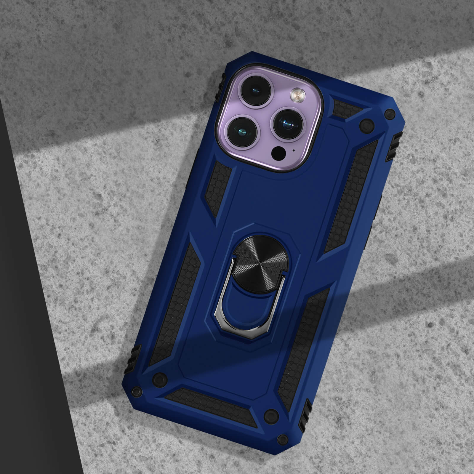 Coque de téléphone bleu foncé avec support anneau sur béton.