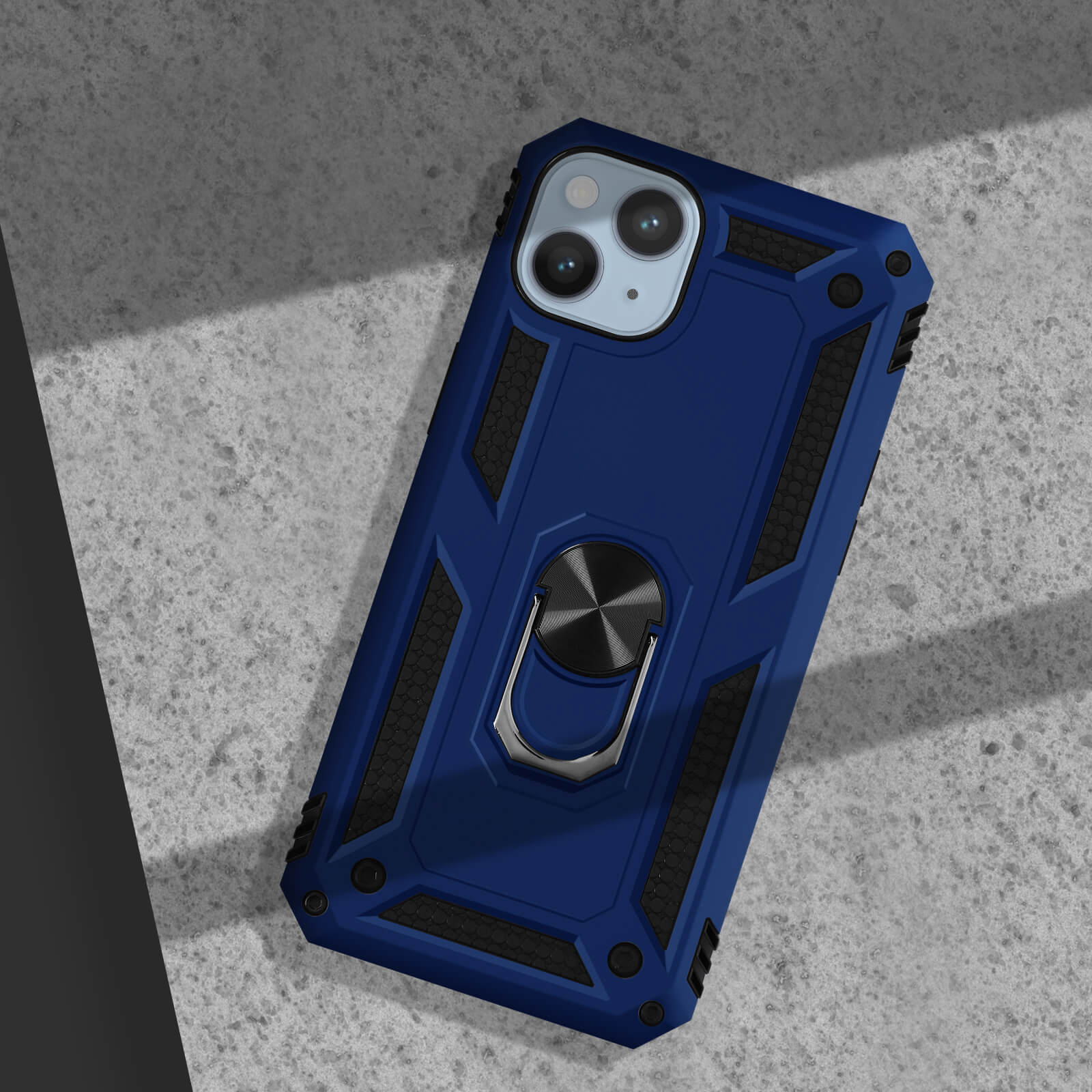Coque de téléphone bleu foncé avec support anneau sur surface en béton.