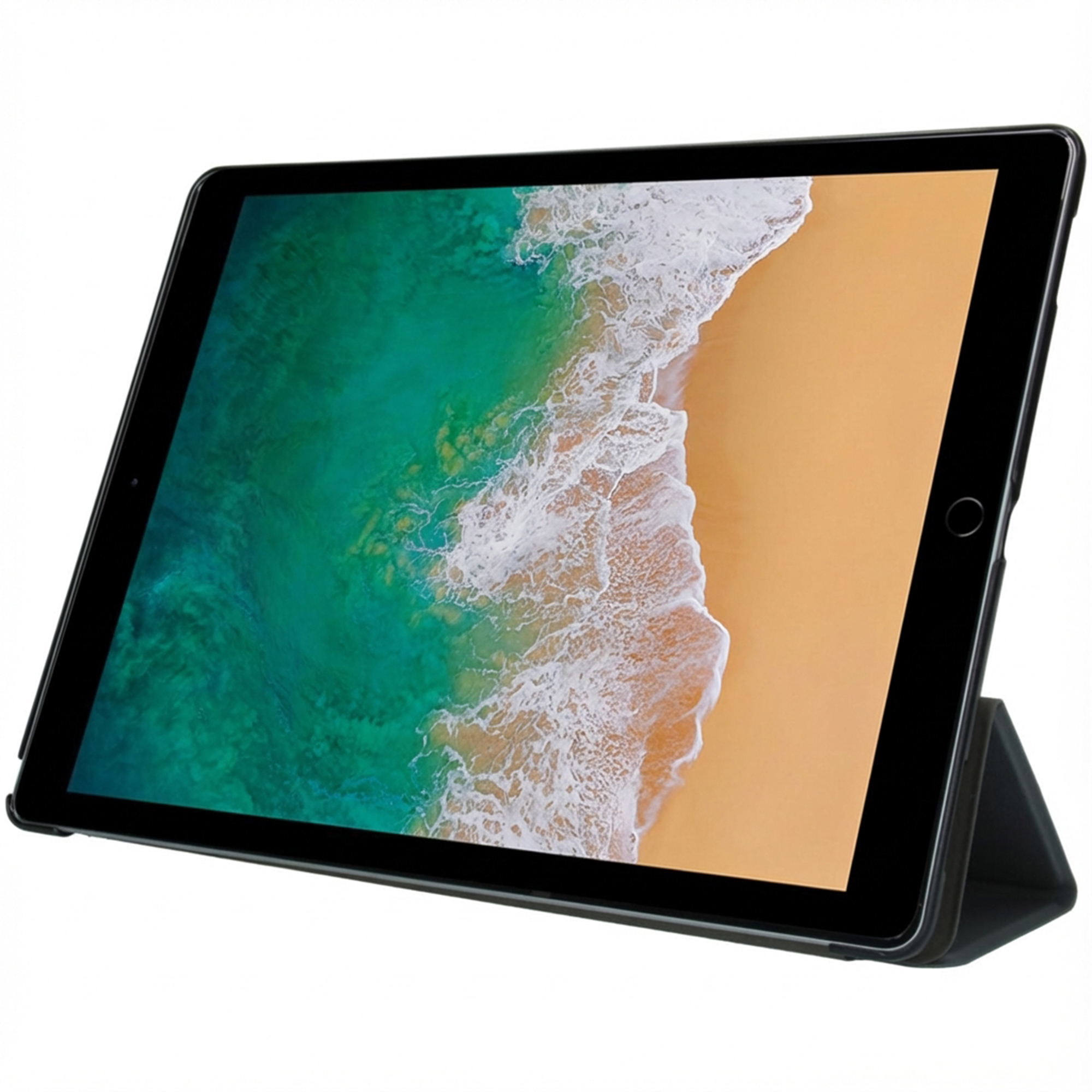 A black tablet stands upright, displaying an image of the sea and a beach on its screen.