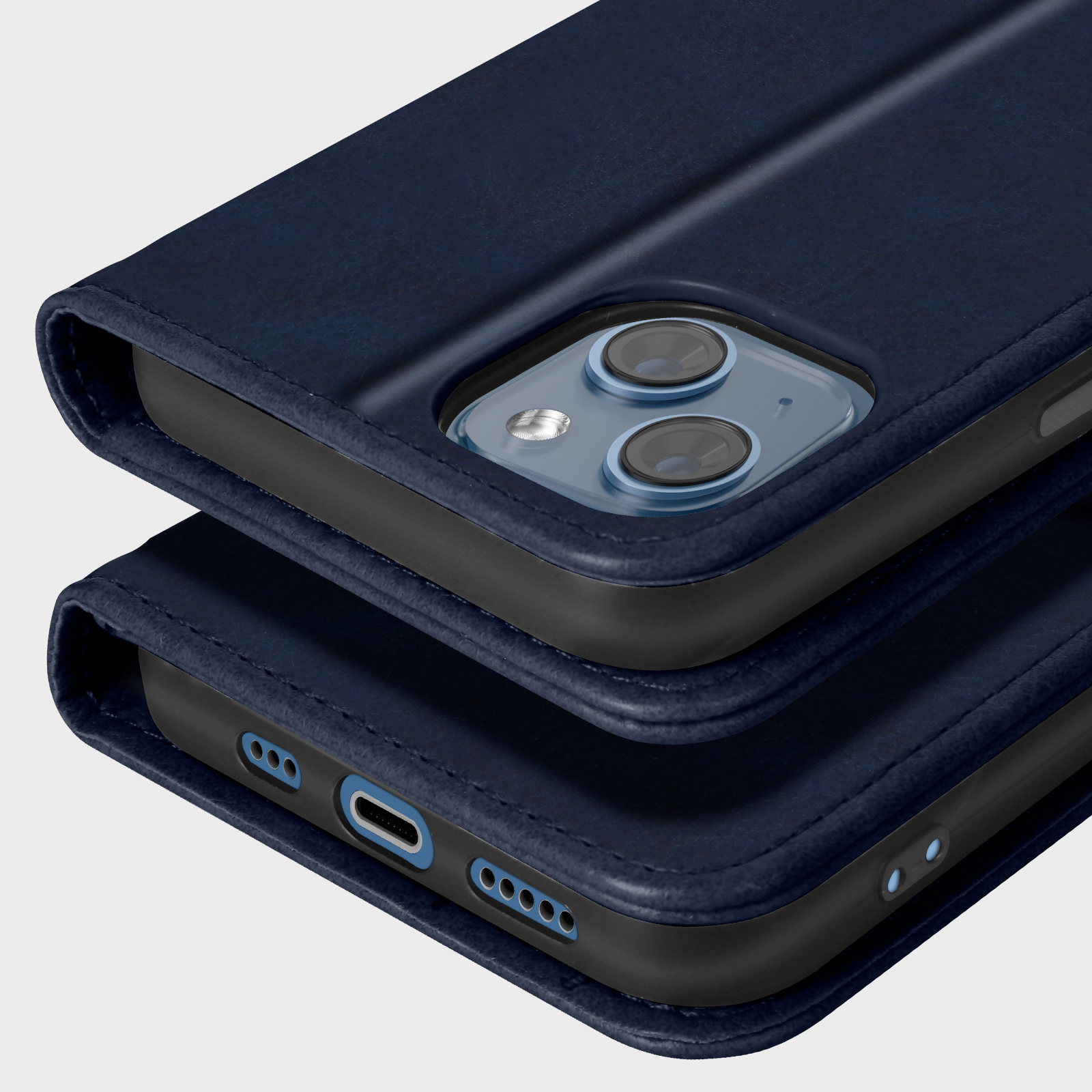 Due custodie per telefono blu navy impilate. La superiore mostra la fotocamera, l'inferiore le porte.