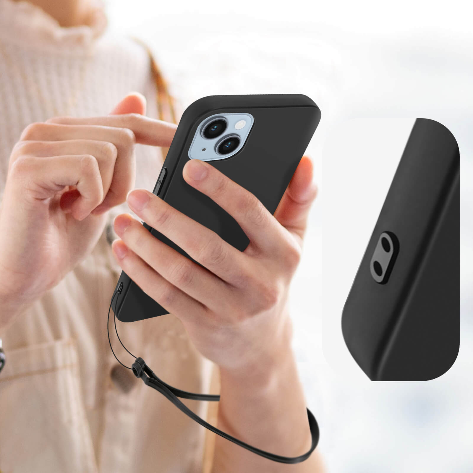 Een persoon houdt een zwarte telefoon met lanyard vast. Close-up van handen.