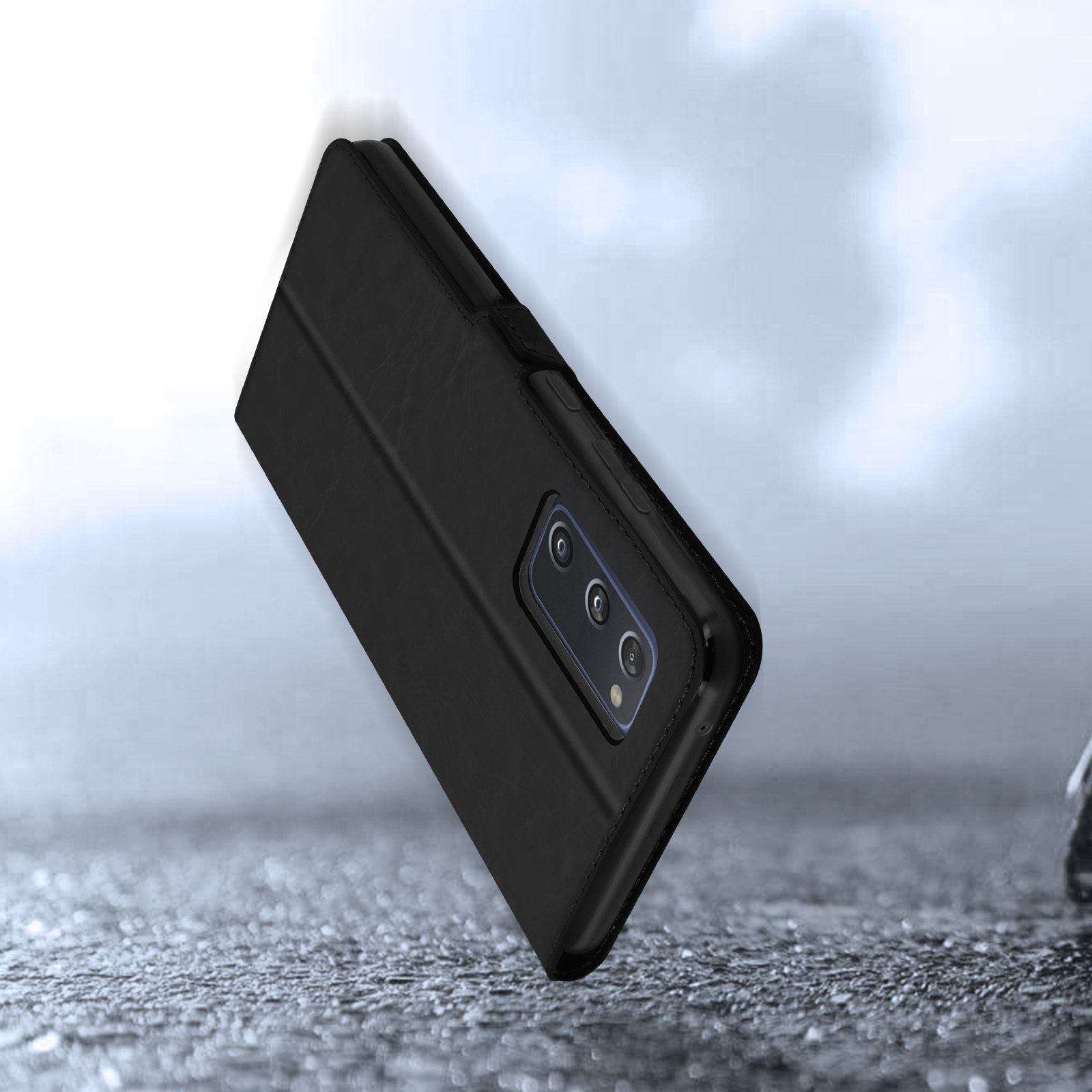 Étui de téléphone noir style portefeuille sur une surface grise texturée.