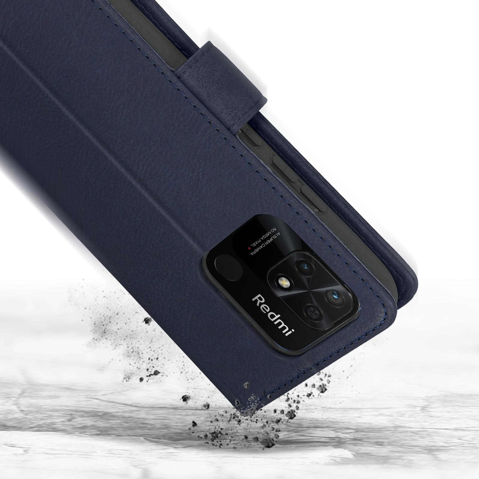 Custodia blu scuro con obiettivi della fotocamera che cadono su una superficie.