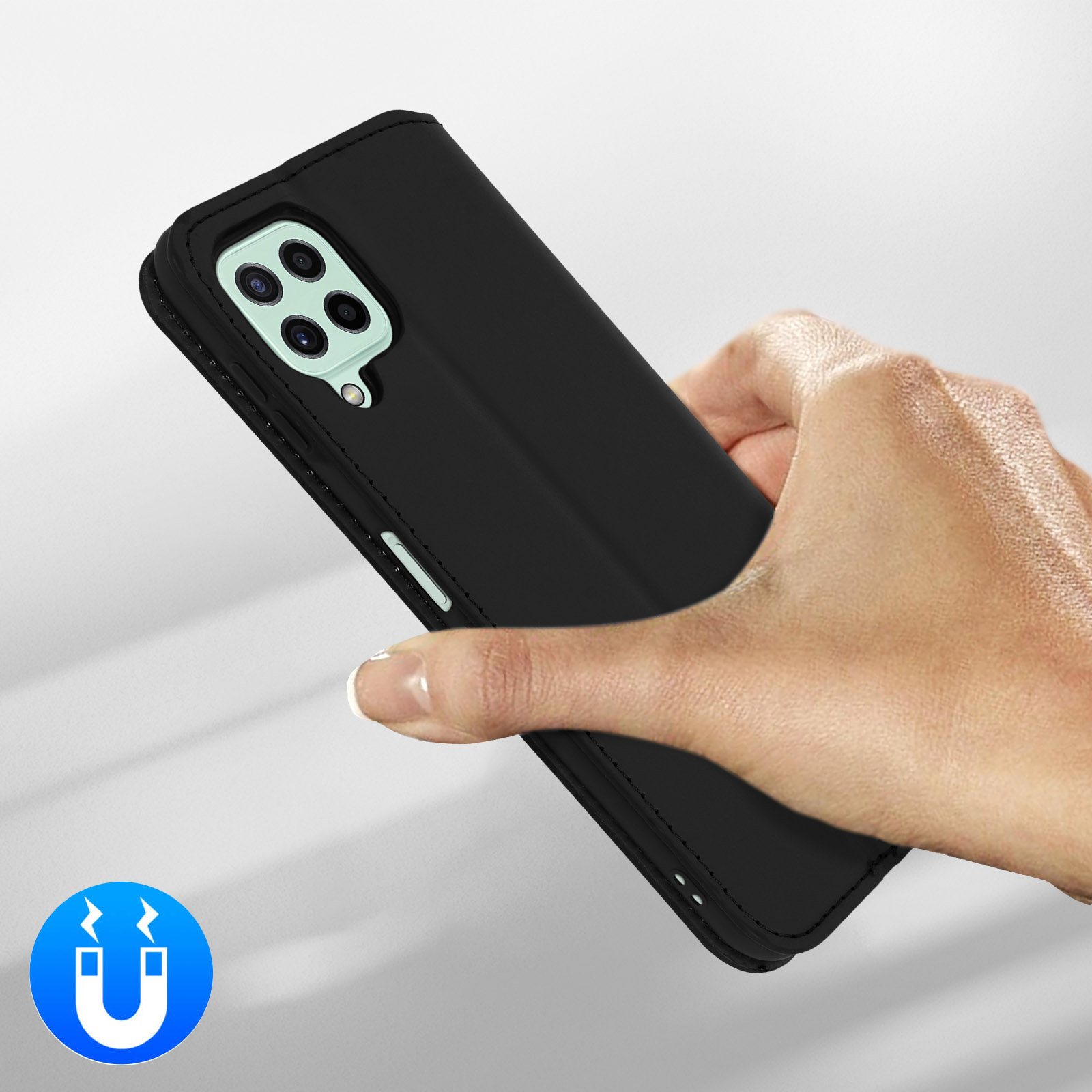 Une main tient un téléphone noir avec quatre caméras. Icône aimant.