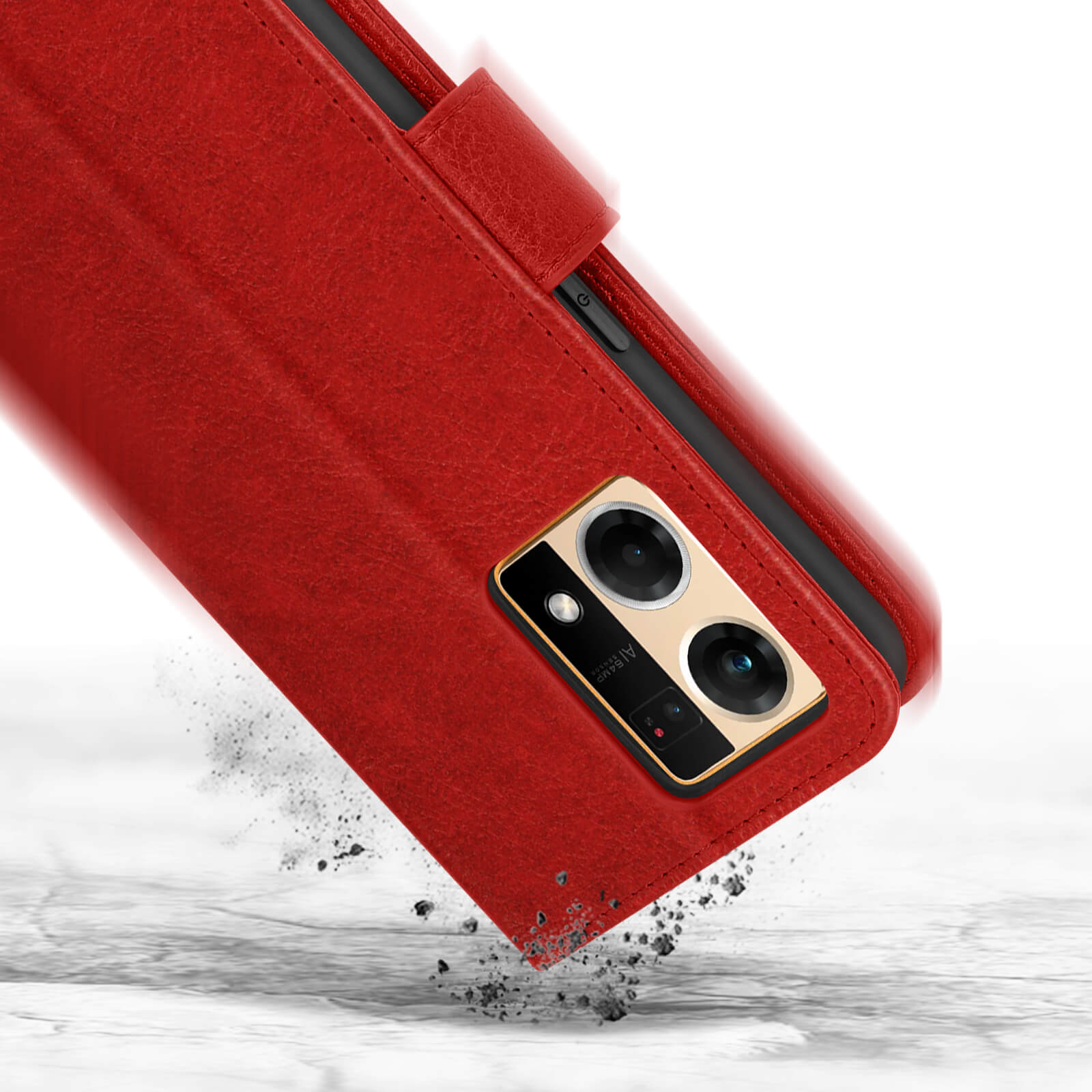 Étui de téléphone rouge avec système de caméra tombant sur surface grise.
