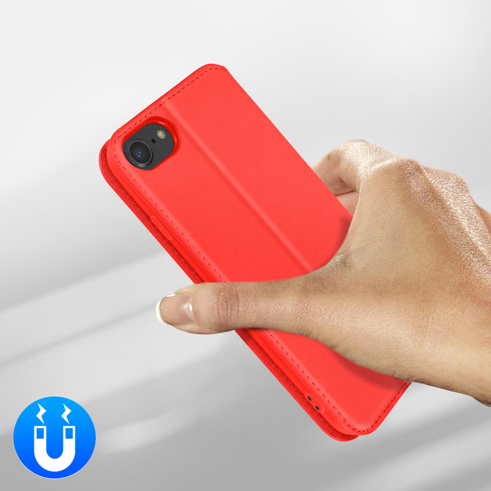 Une coque de téléphone rouge tenue par une main, avec icône magnétique.