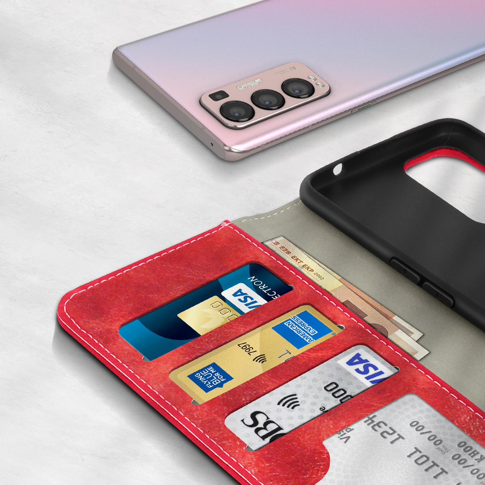 Portefeuille rouge avec cartes de crédit et billets à côté d'un téléphone.