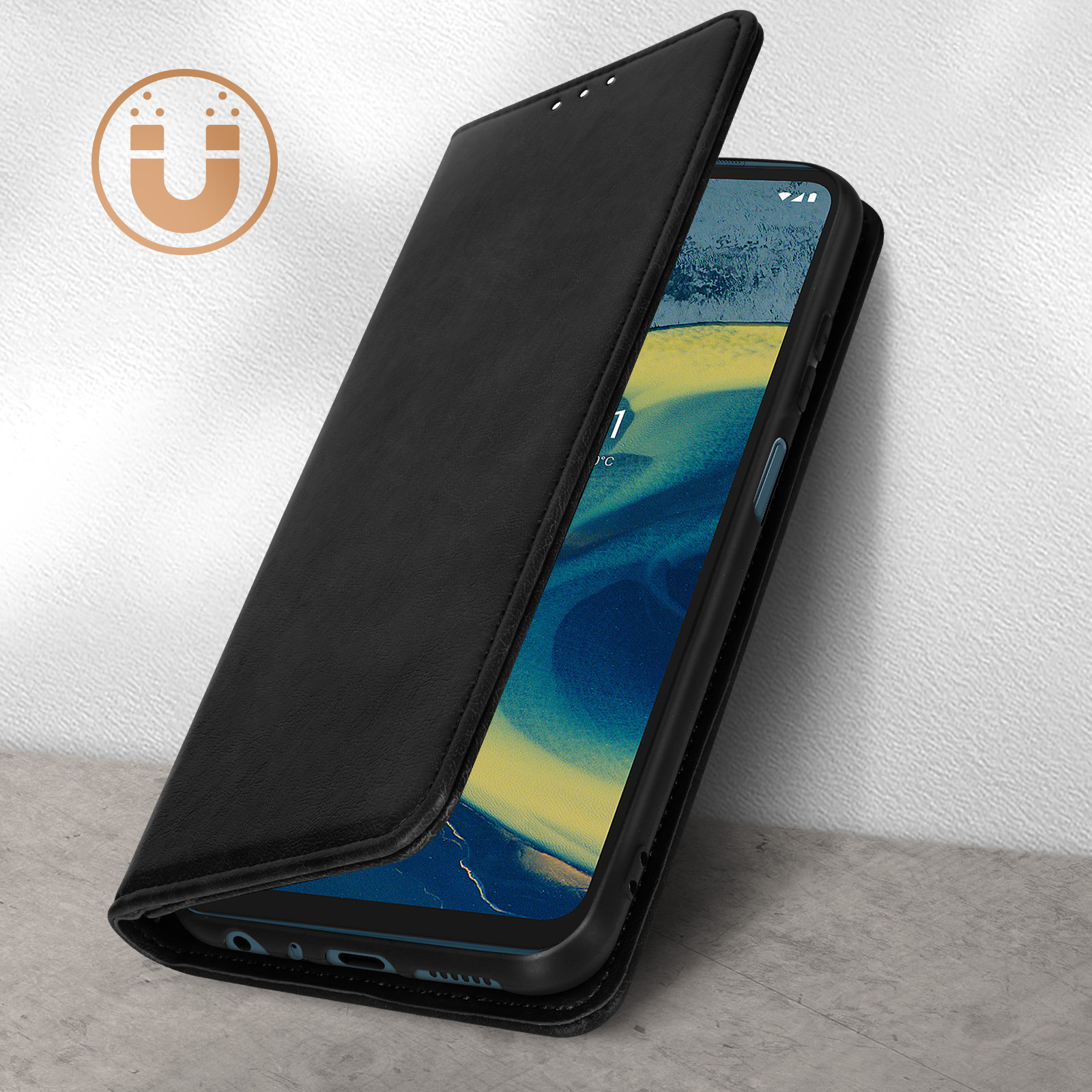 Téléphone noir avec étui à clapet ouvert sur sol en béton, icône aimant.