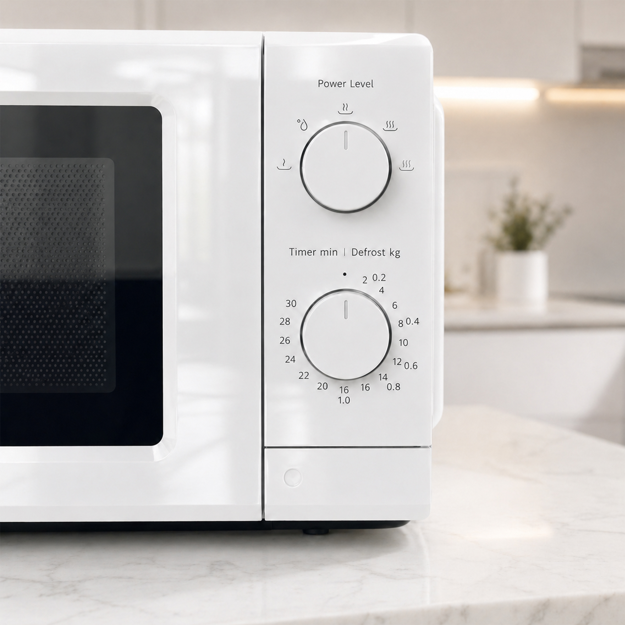 White microwave with two dials for power level and timer/defrost settings.