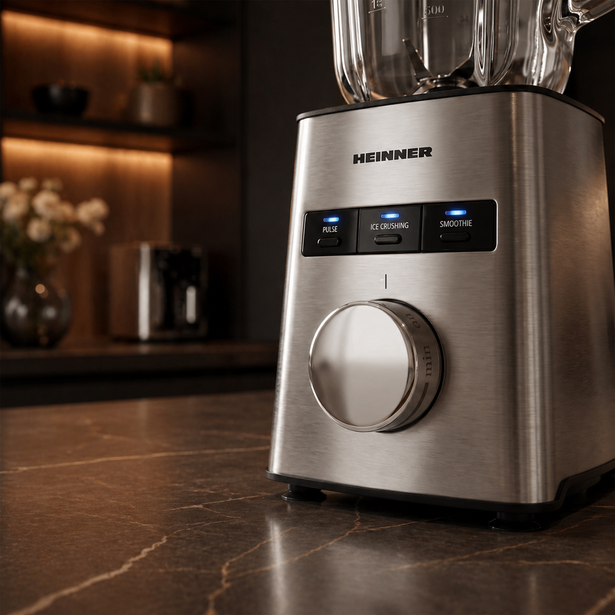 A silver Heinner blender with illuminated buttons on a marble countertop.