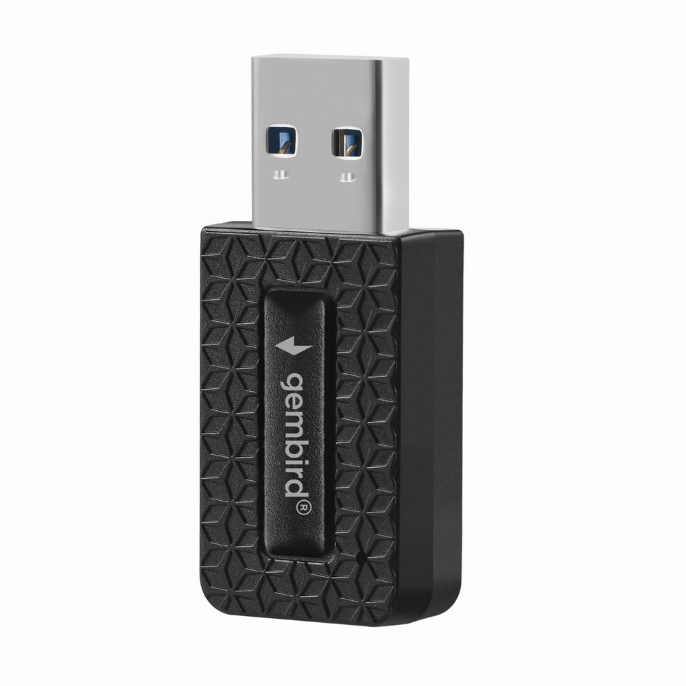 Un adaptateur USB noir avec connecteur argenté et motif texturé.