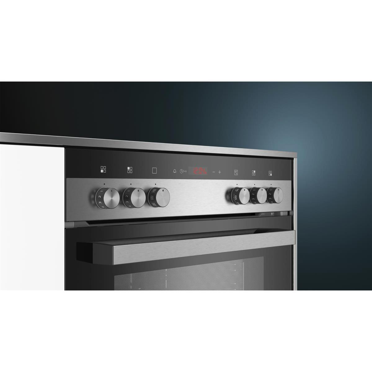 Stainless steel oven with digital display and control knobs.