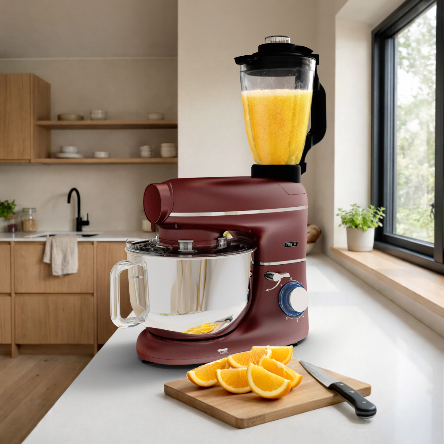 A burgundy stand mixer with a blender attachment and orange slices.