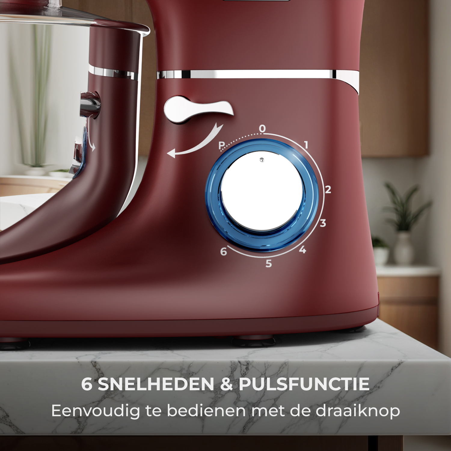 Impastatrice rossa con 6 velocità e funzione pulse su piano marmo.