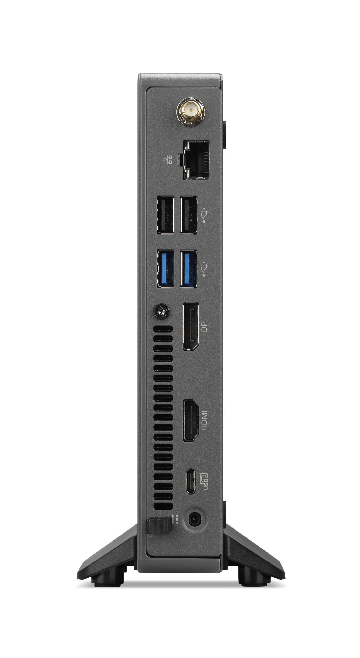 Mini PC grigio con porte: antenna, Ethernet, USB-A, USB-C, DP, HDMI. Poggia su piedini neri.