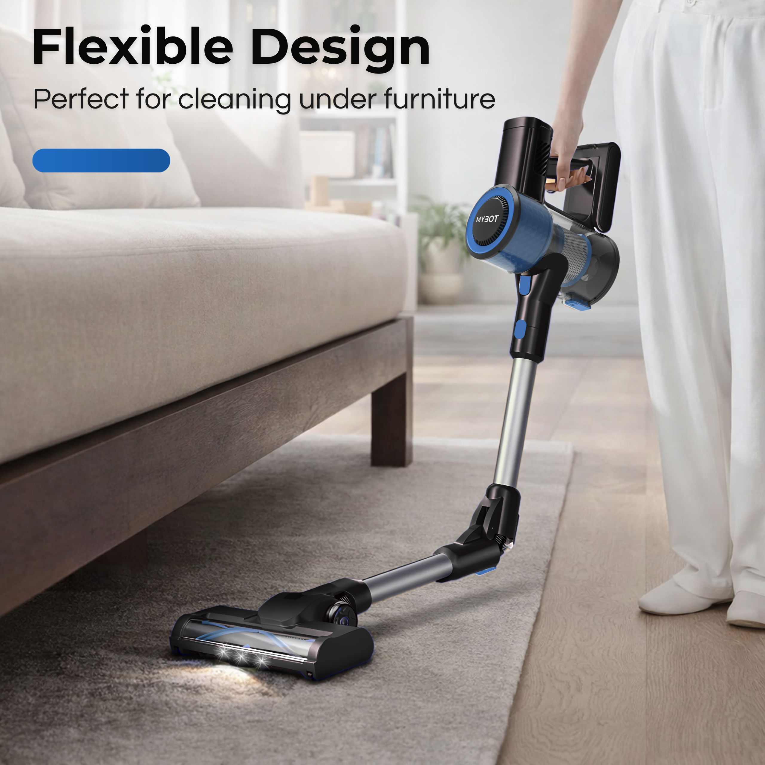 A blue and black vacuum cleaner cleans under a sofa on a carpet.