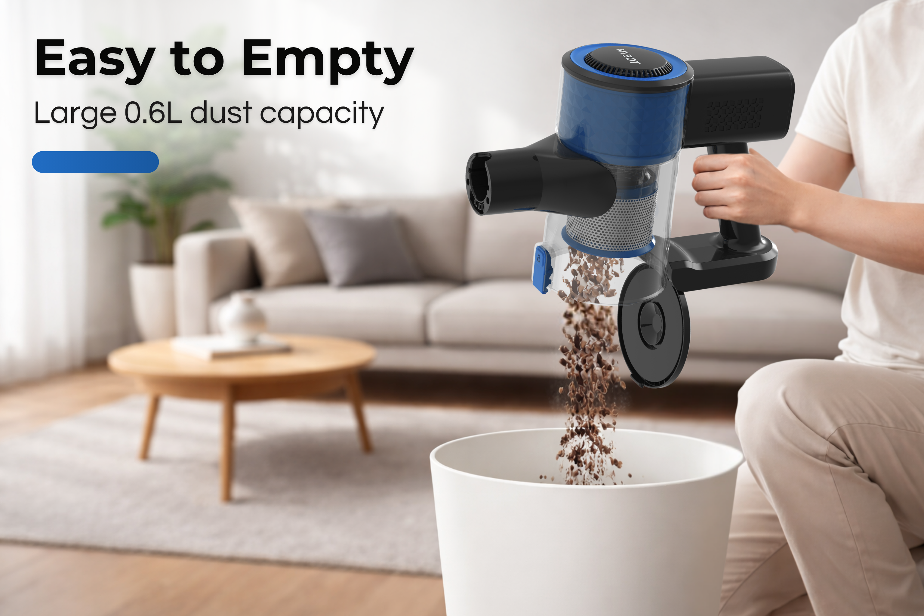 A handheld vacuum cleaner empties its contents into a white trash bin.