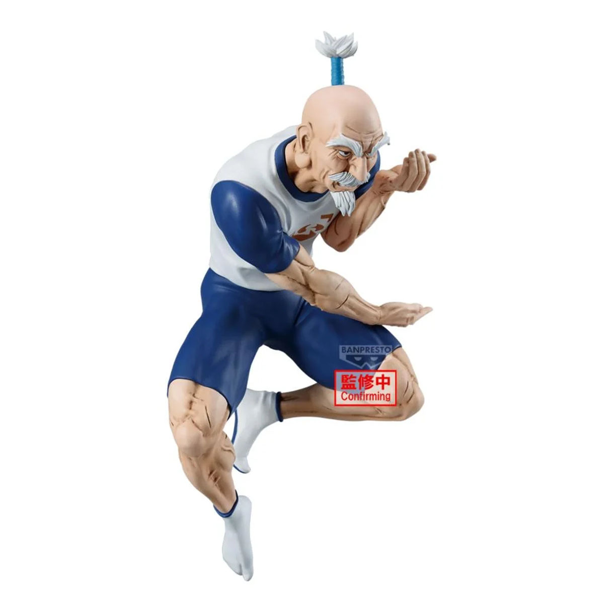 Eine Figur eines alten Mannes mit weißem Haar, der in einem blauen und weißen Trainingsanzug kniet.