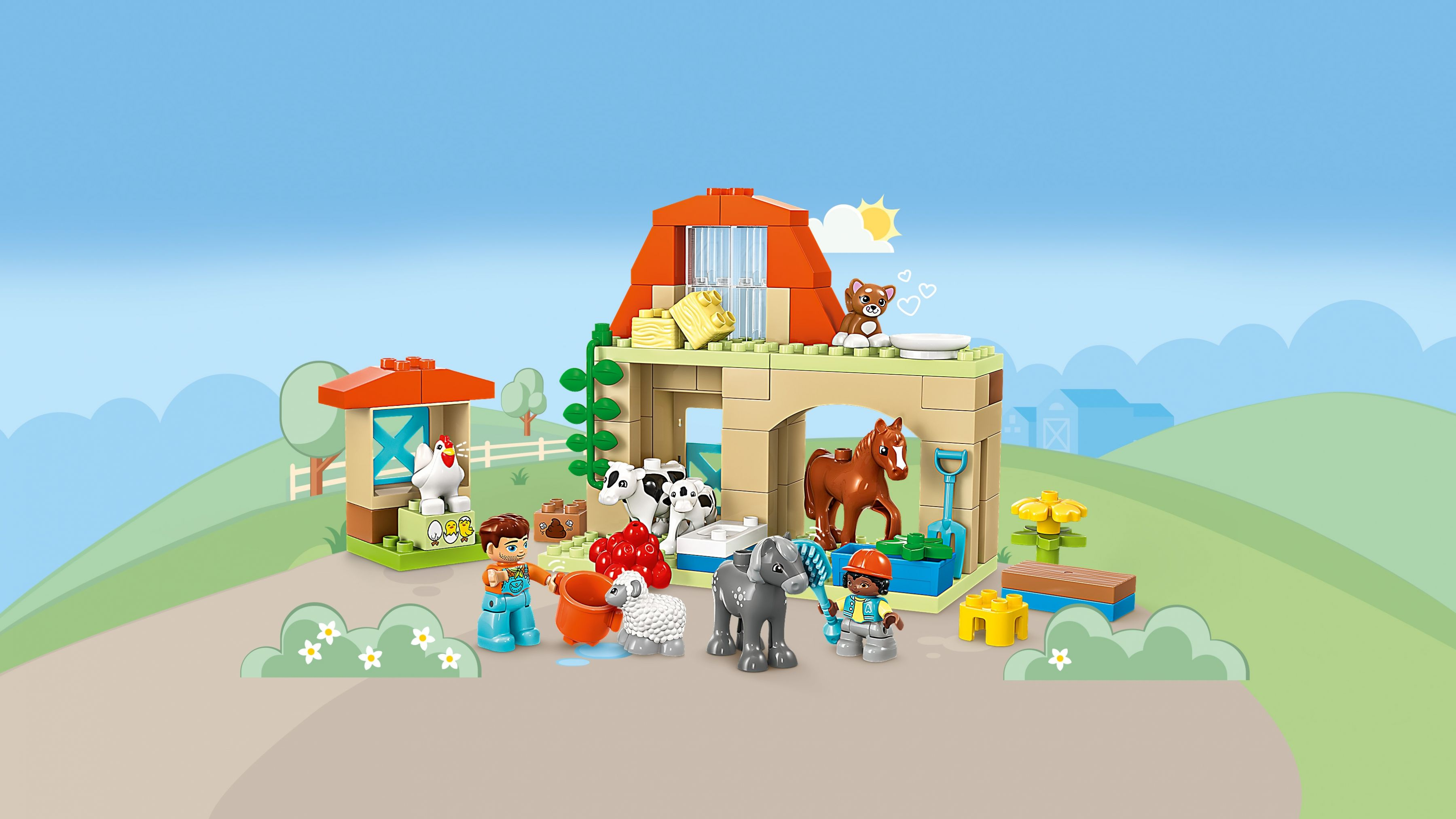 Eine Lego-Bauernhofszene mit Scheune, Tieren und Menschen unter blauem Himmel.