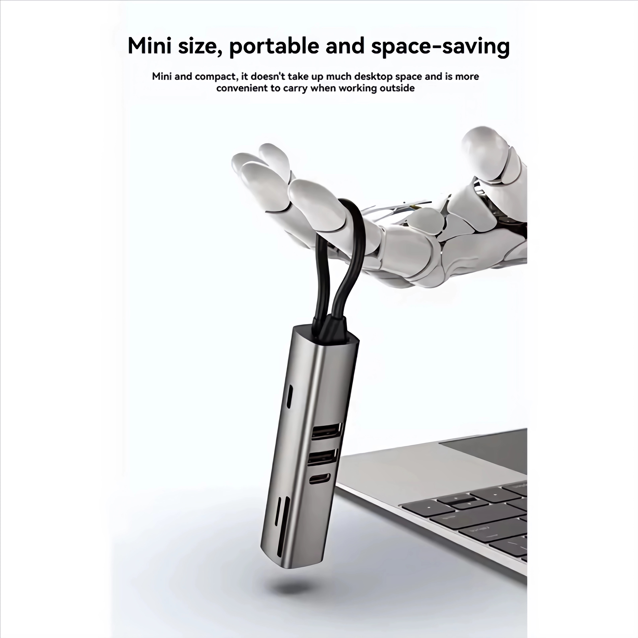 Ein silberner USB-C-Hub mit mehreren Anschlüssen hängt von einer Roboterhand über einem Laptop.