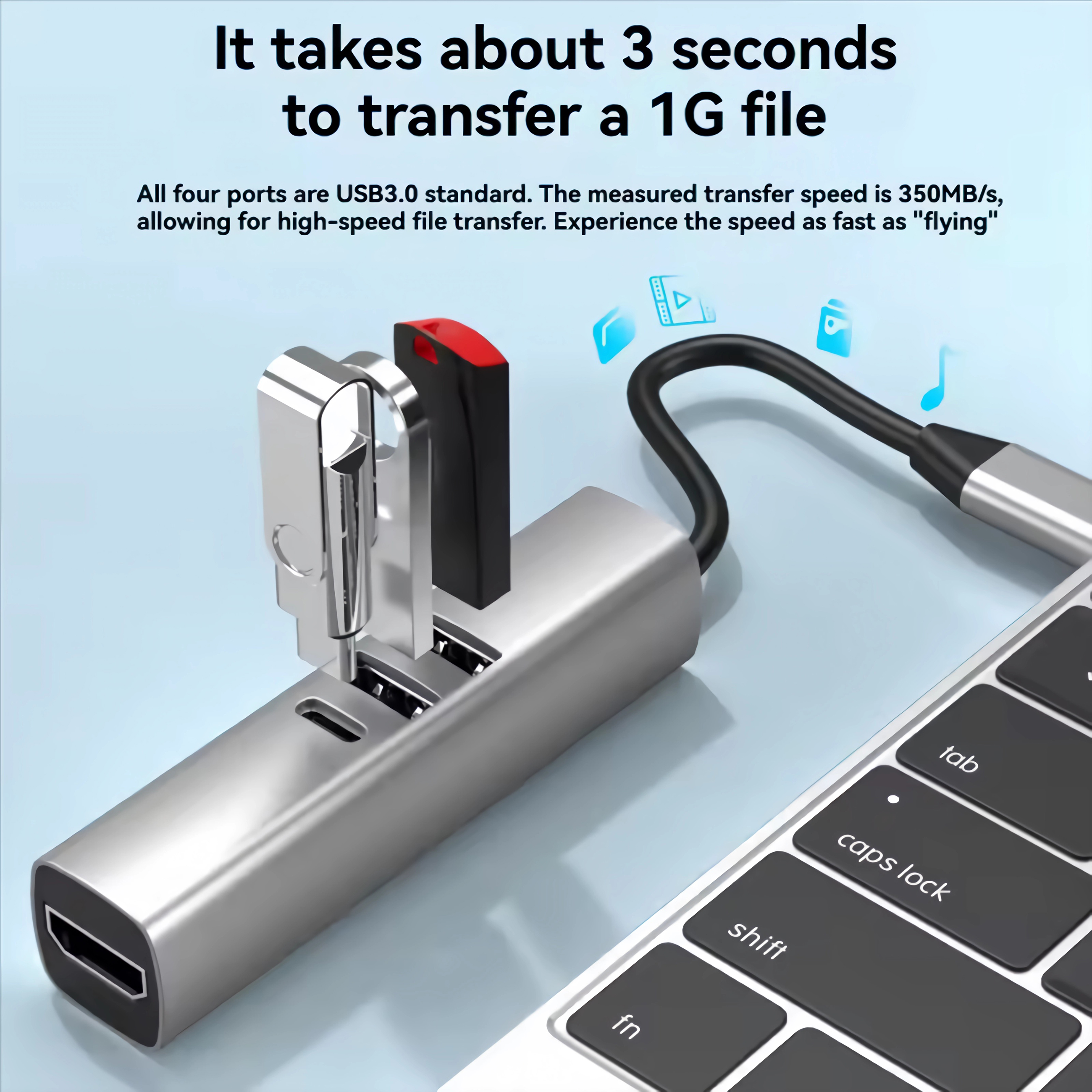 Ein silberner USB-Hub mit angeschlossenen Geräten und einer Tastatur.