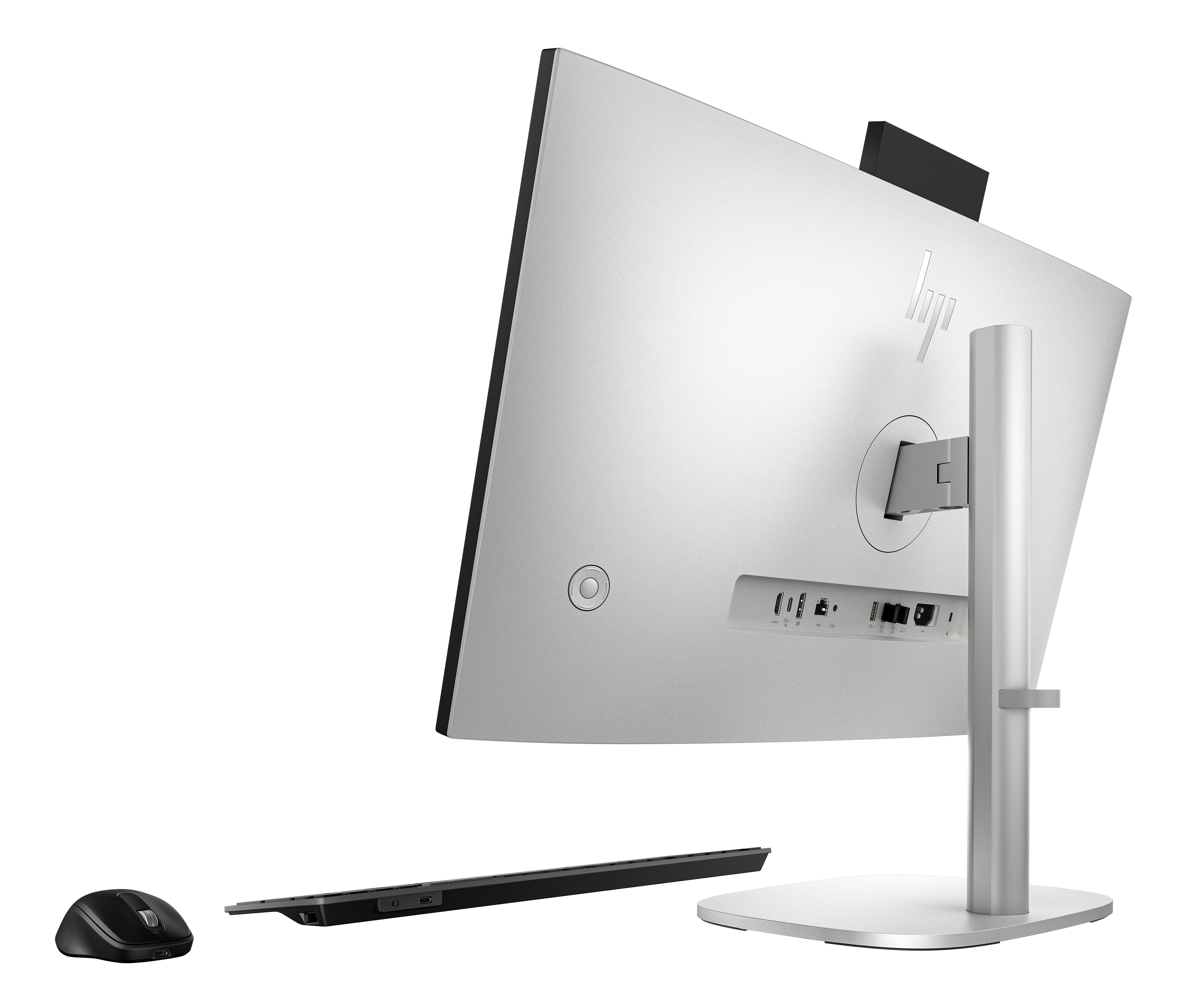 Vista posteriore di un computer all-in-one argentato con mouse e tastiera.