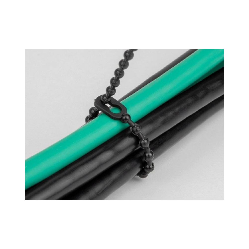 Schwarzes Kabelbinder hält grüne und schwarze Kabel zusammen.