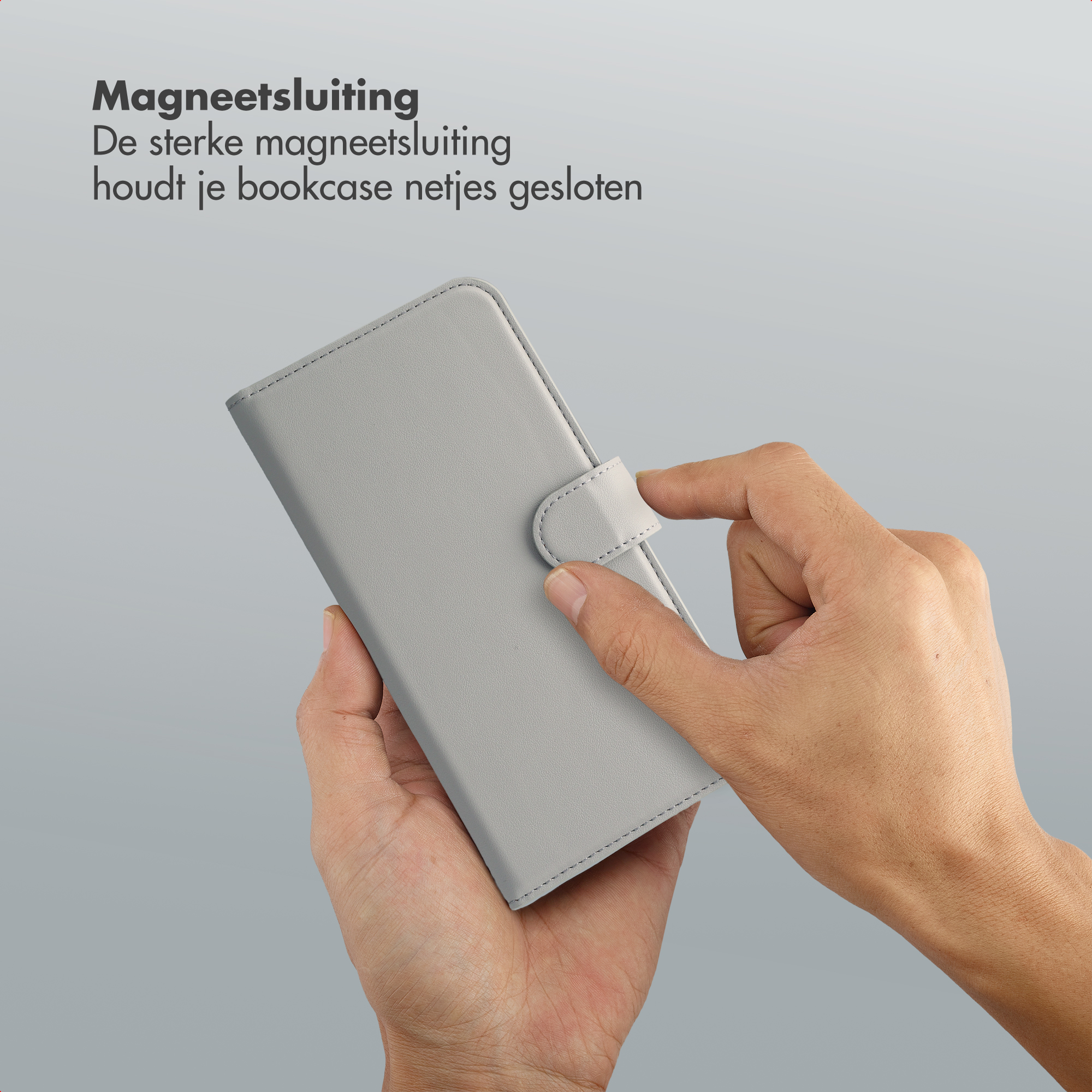 Grijze telefoonhoes met magnetische sluiting, wordt door hand gesloten.