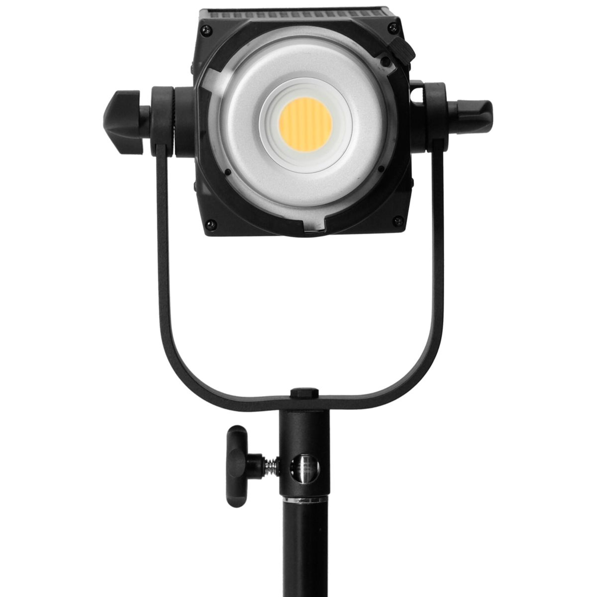 Ein Studio-LED-Spot mit gelbem Licht auf einem Stativ, nahaufnahme.